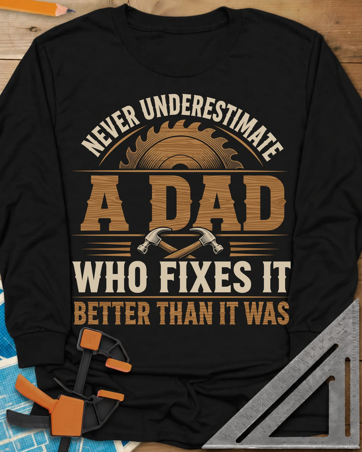 Never Underestimate A Dad Who Fixes It long sleeve shirt in Black, saw blade and two crossed hammers around wood-grain