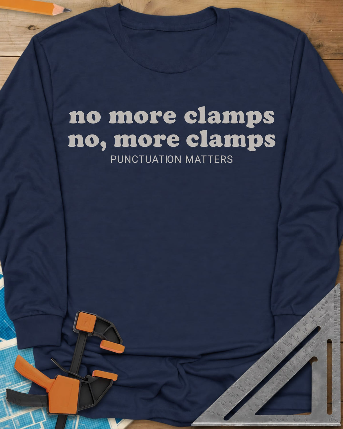 No More Clamps Punctuation Matters long sleeve shirt in Navy, two lowercase retro lines that differ by a comma, tagline below