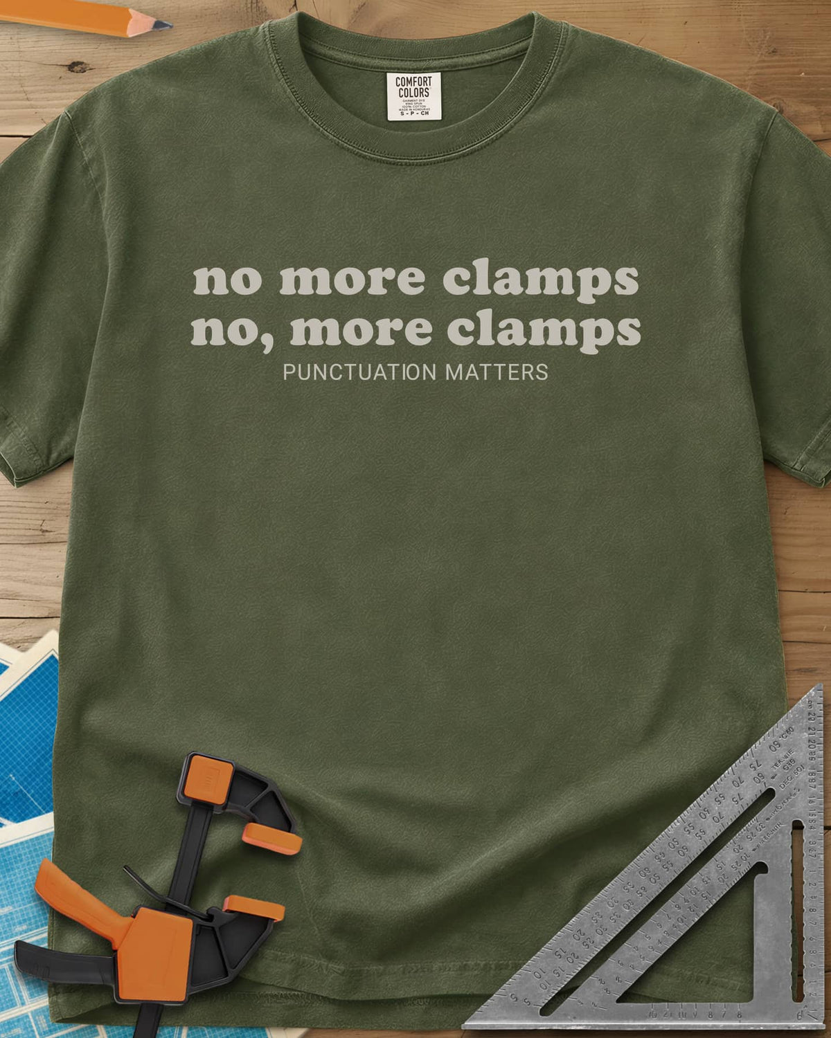 No More Clamps Punctuation Matters heavyweight tee in Hemp, two lowercase retro lines that differ by a comma, tagline below