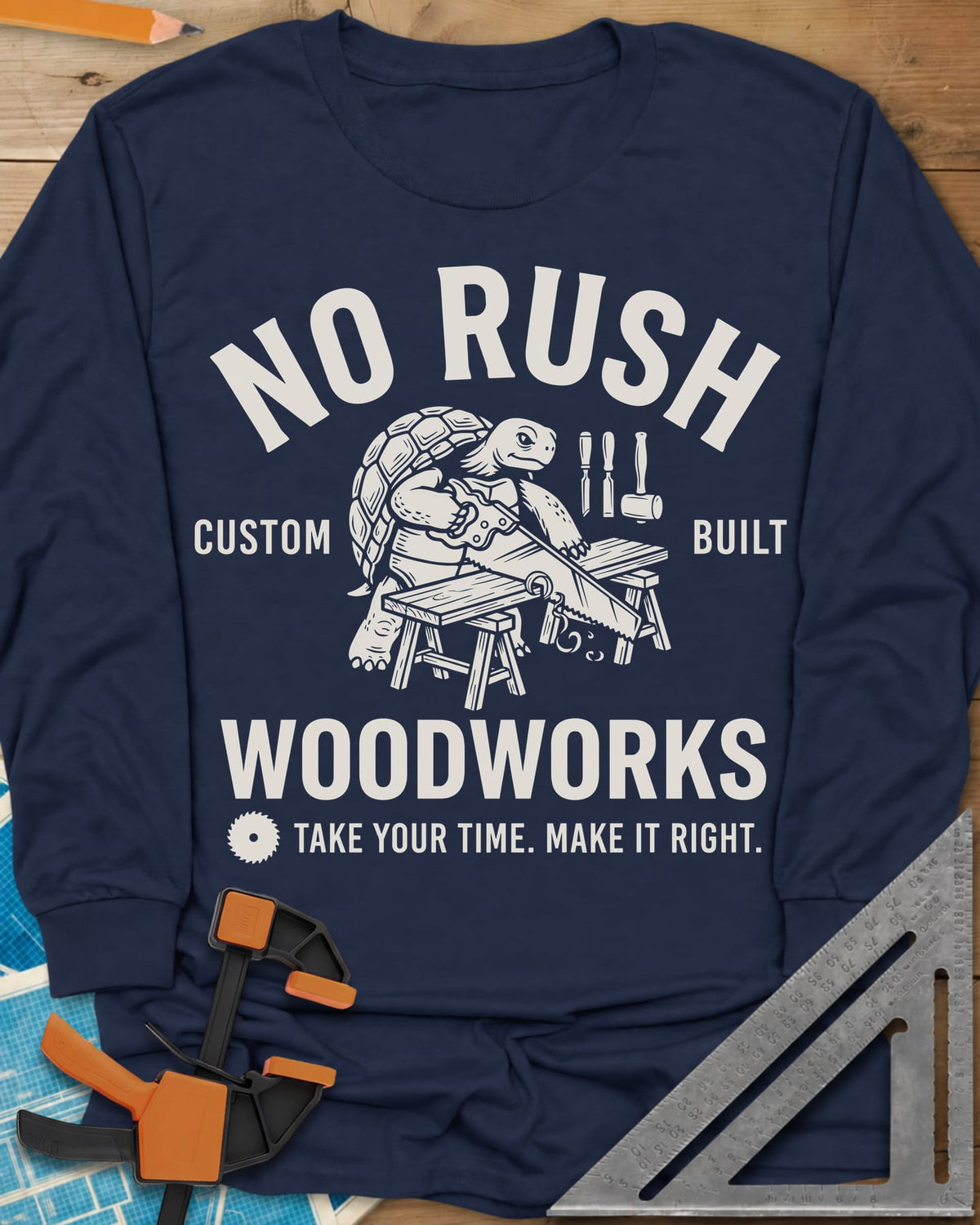 No Rush Woodworks long sleeve shirt in Navy, a tortoise sawing a board on sawhorses inside a woodshop badge