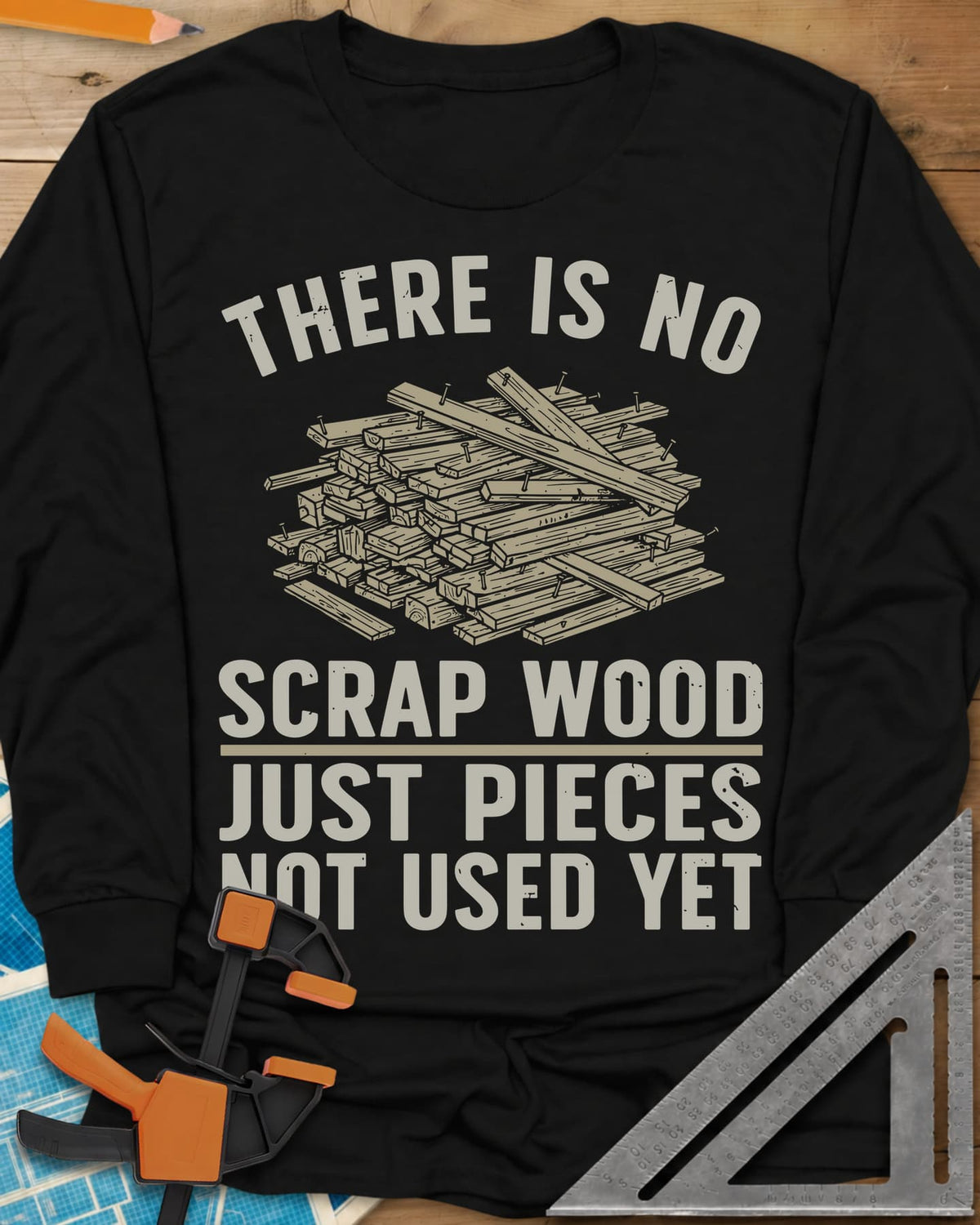 No Scrap Wood long sleeve shirt in Black, a tall pile of offcut boards with a few nails sticking out