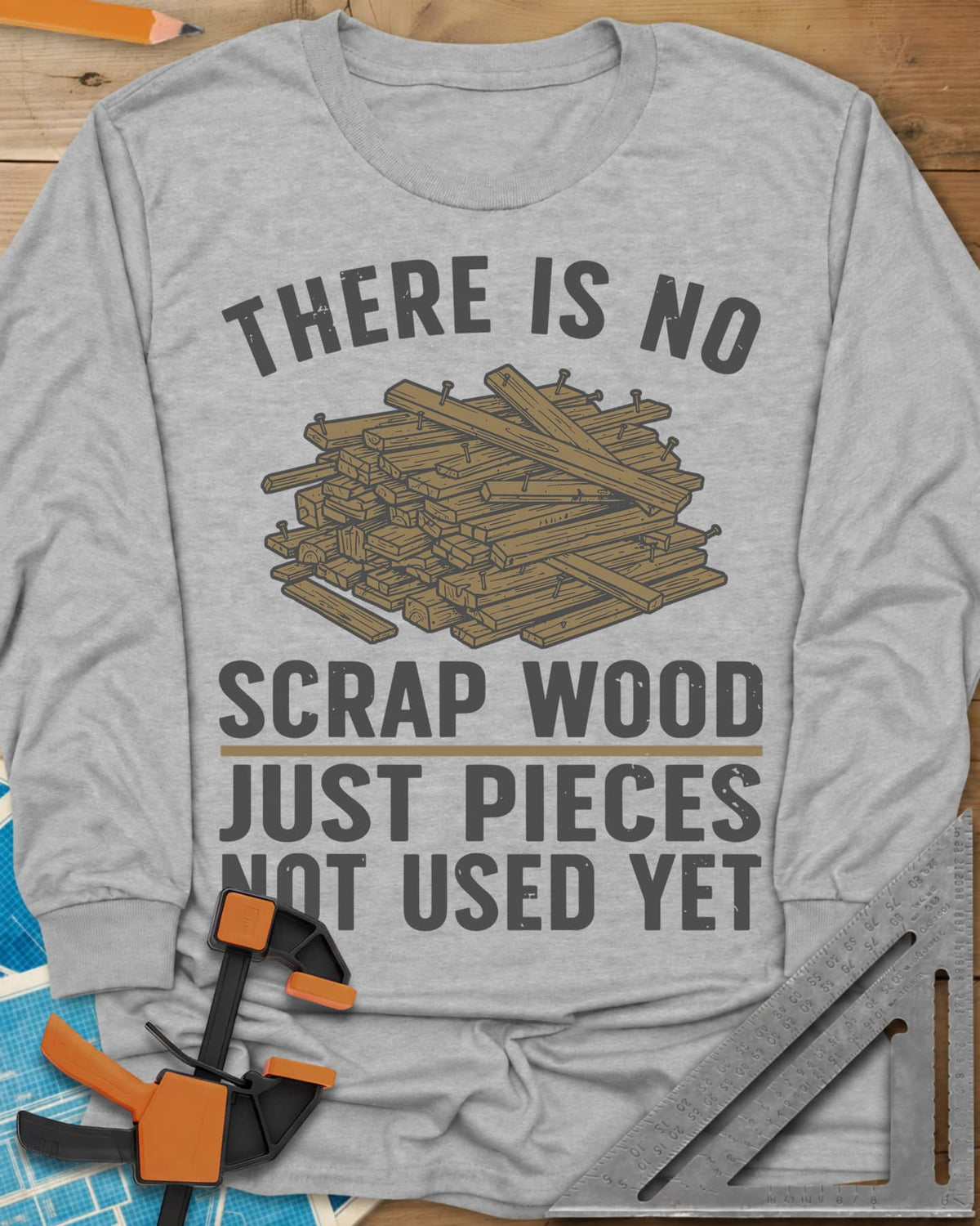 No Scrap Wood long sleeve shirt in Sport Grey, a tall pile of offcut boards with a few nails sticking out