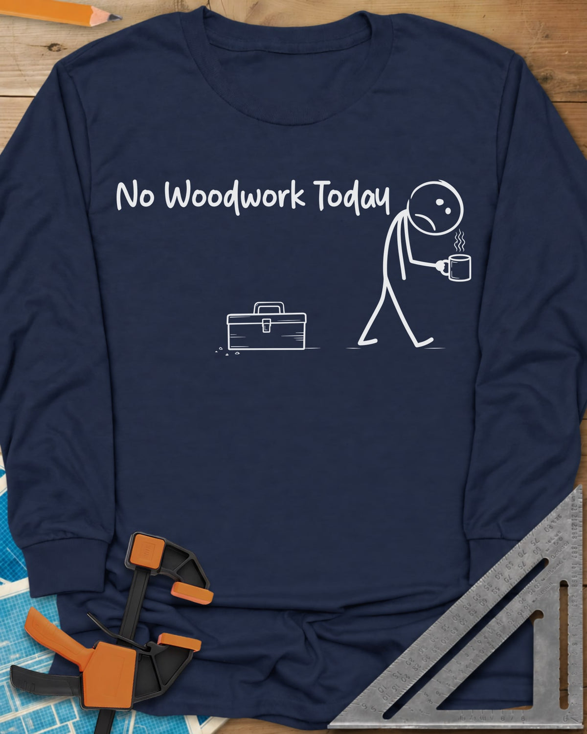 No Woodwork Today long sleeve shirt in Navy, a sad stick figure with a mug walking past a closed toolbox