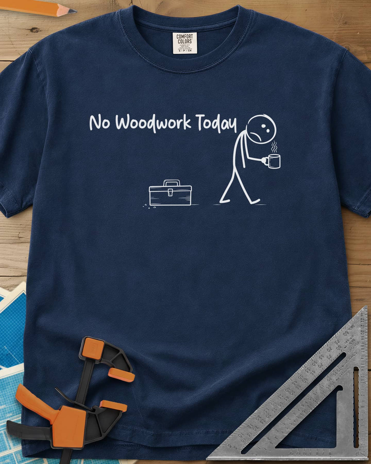 No Woodwork Today heavyweight tee in Navy, a sad stick figure with a mug walking past a closed toolbox