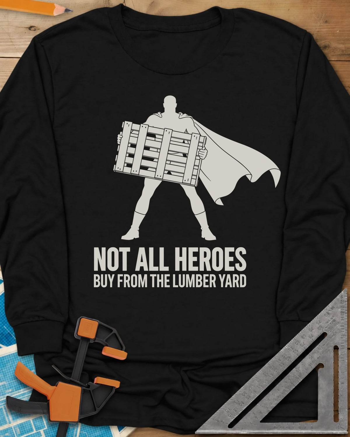 Not All Heroes long sleeve shirt in Black, a caped hero silhouette holding a wooden shipping pallet
