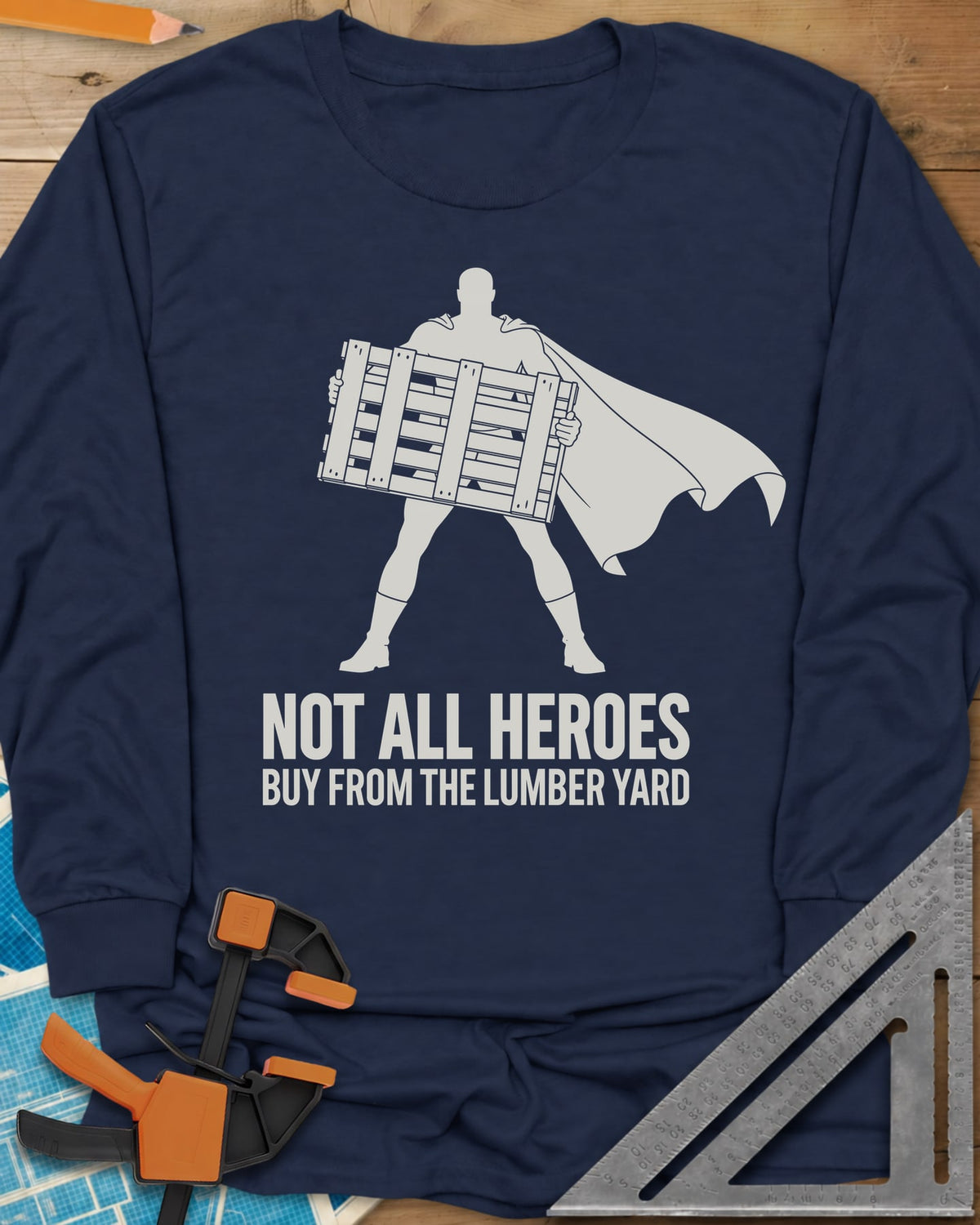 Not All Heroes long sleeve shirt in Navy, a caped hero silhouette holding a wooden shipping pallet