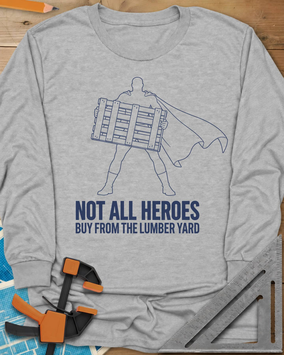 Not All Heroes long sleeve shirt in Sport Grey, a caped hero silhouette holding a wooden shipping pallet