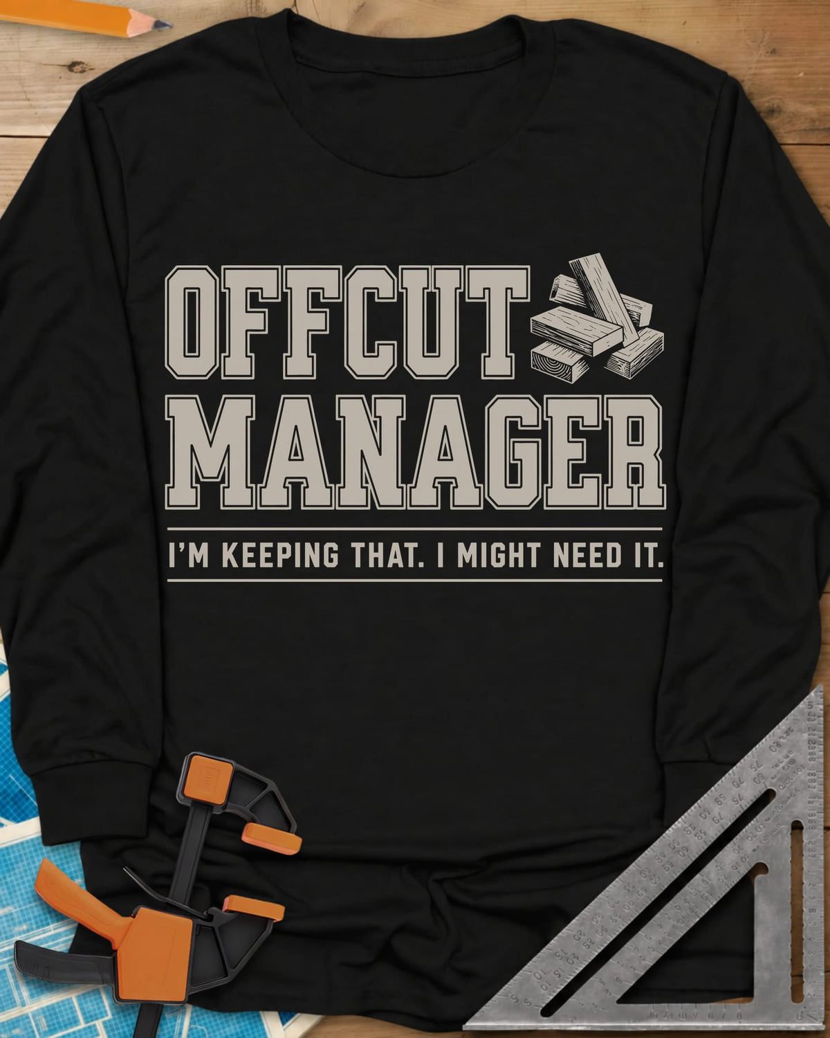 Offcut Manager long sleeve shirt in Black, varsity block lettering beside a little stack of wood offcuts