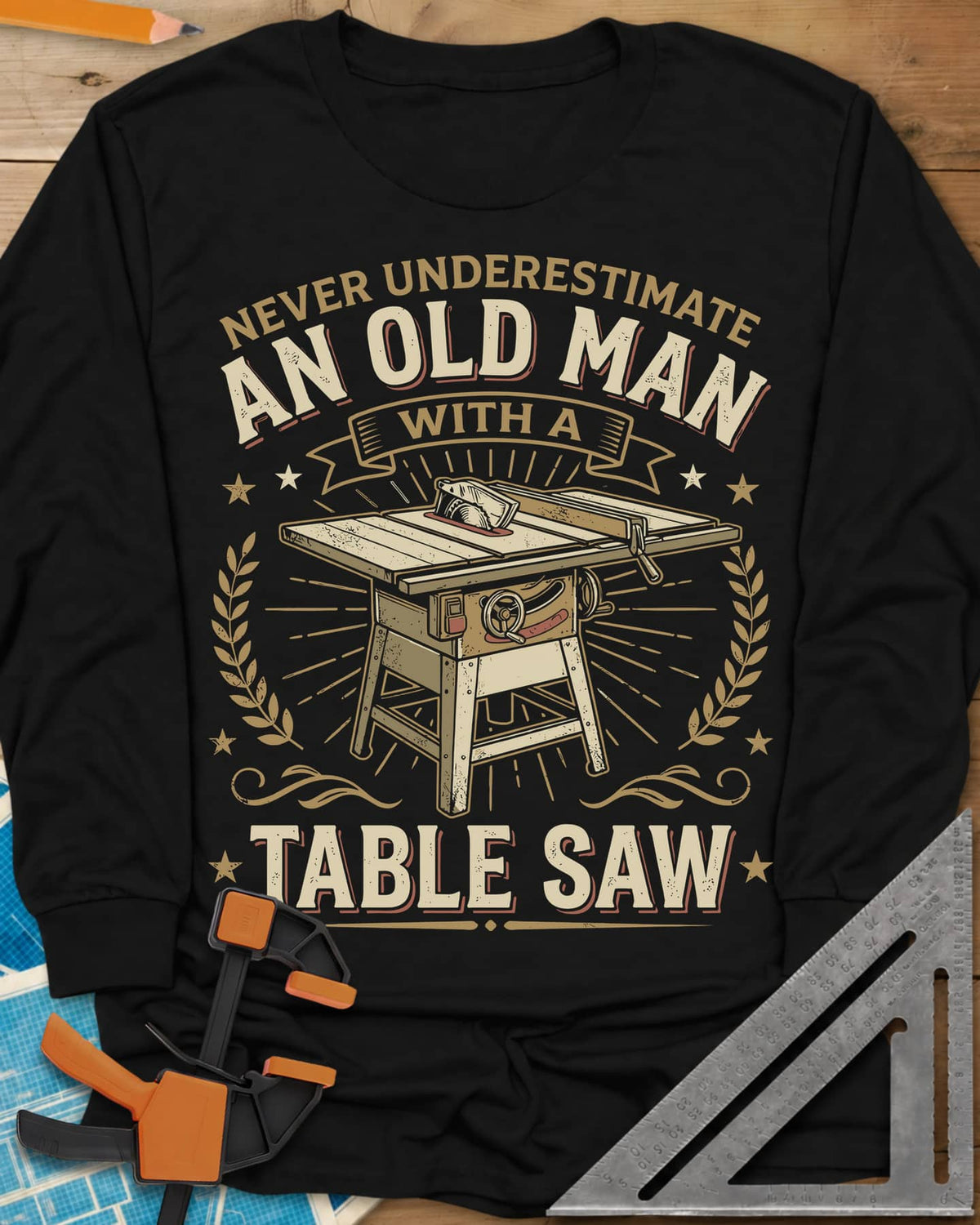 Old Man With A Table Saw long sleeve shirt in Black, a cabinet table saw in a laurel and star badge with a banner