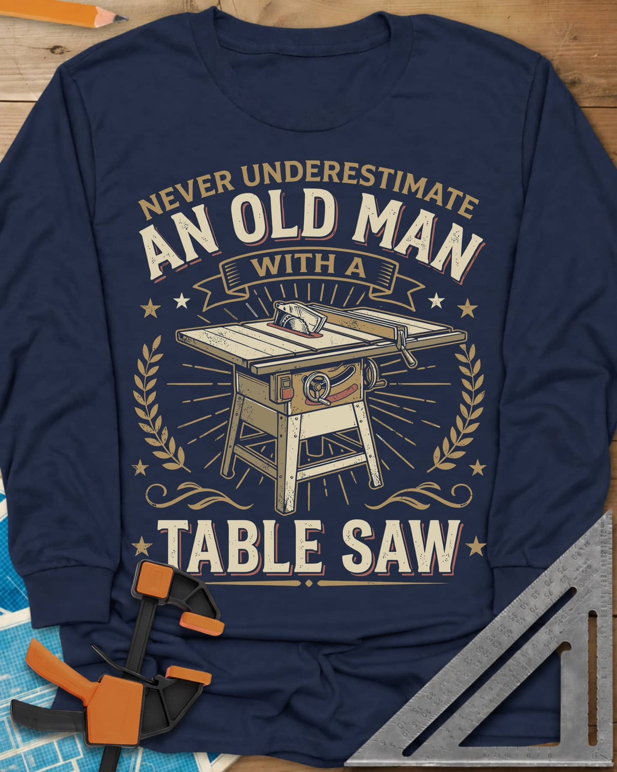Old Man With A Table Saw long sleeve shirt in Navy, a cabinet table saw in a laurel and star badge with a banner