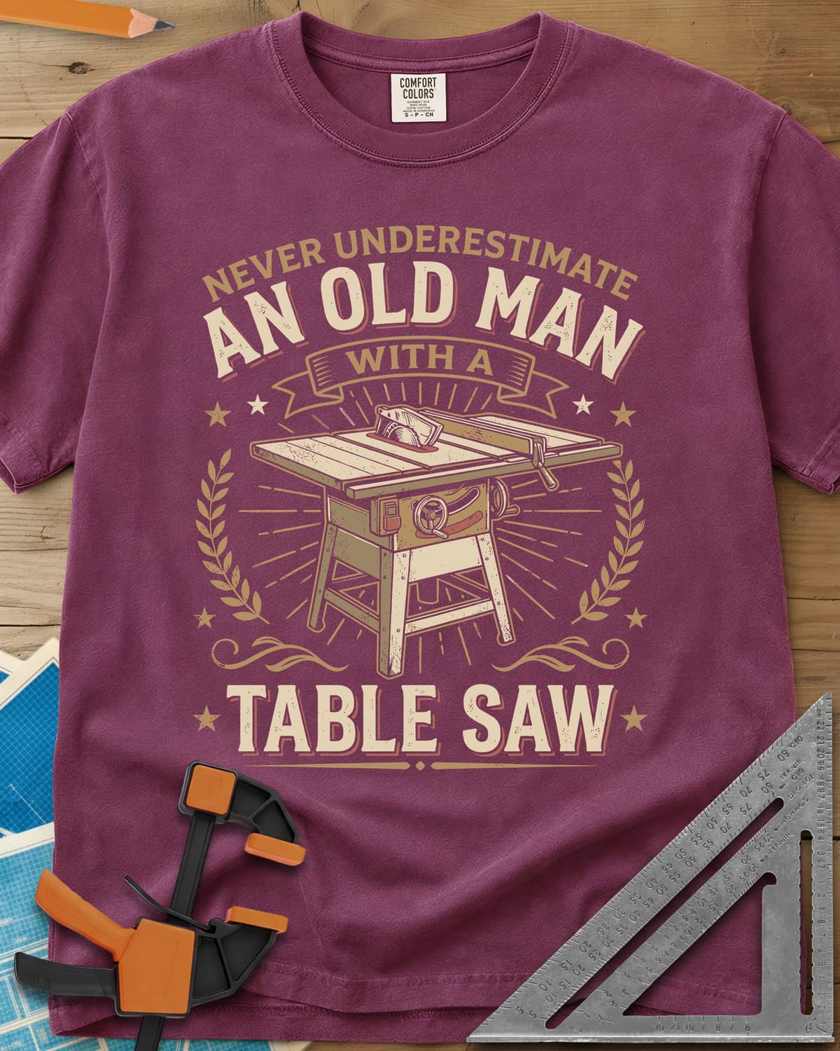 Old Man With A Table Saw heavyweight tee in Berry, a cabinet table saw in a laurel and star badge with a banner