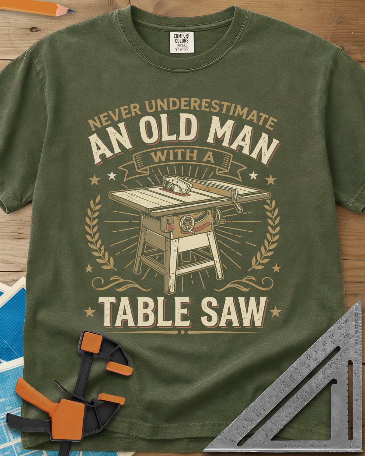 Old Man With A Table Saw heavyweight tee in Hemp, a cabinet table saw in a laurel and star badge with a banner