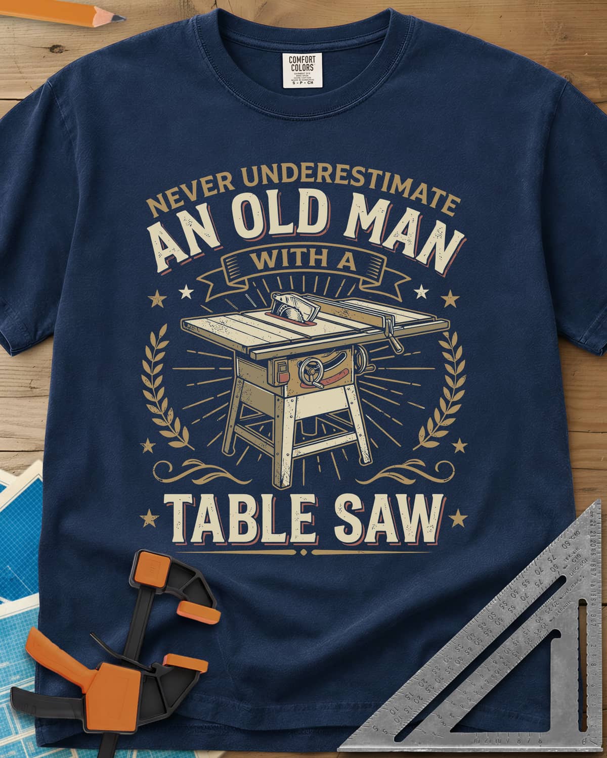 Old Man With A Table Saw heavyweight tee in Navy, a cabinet table saw in a laurel and star badge with a banner