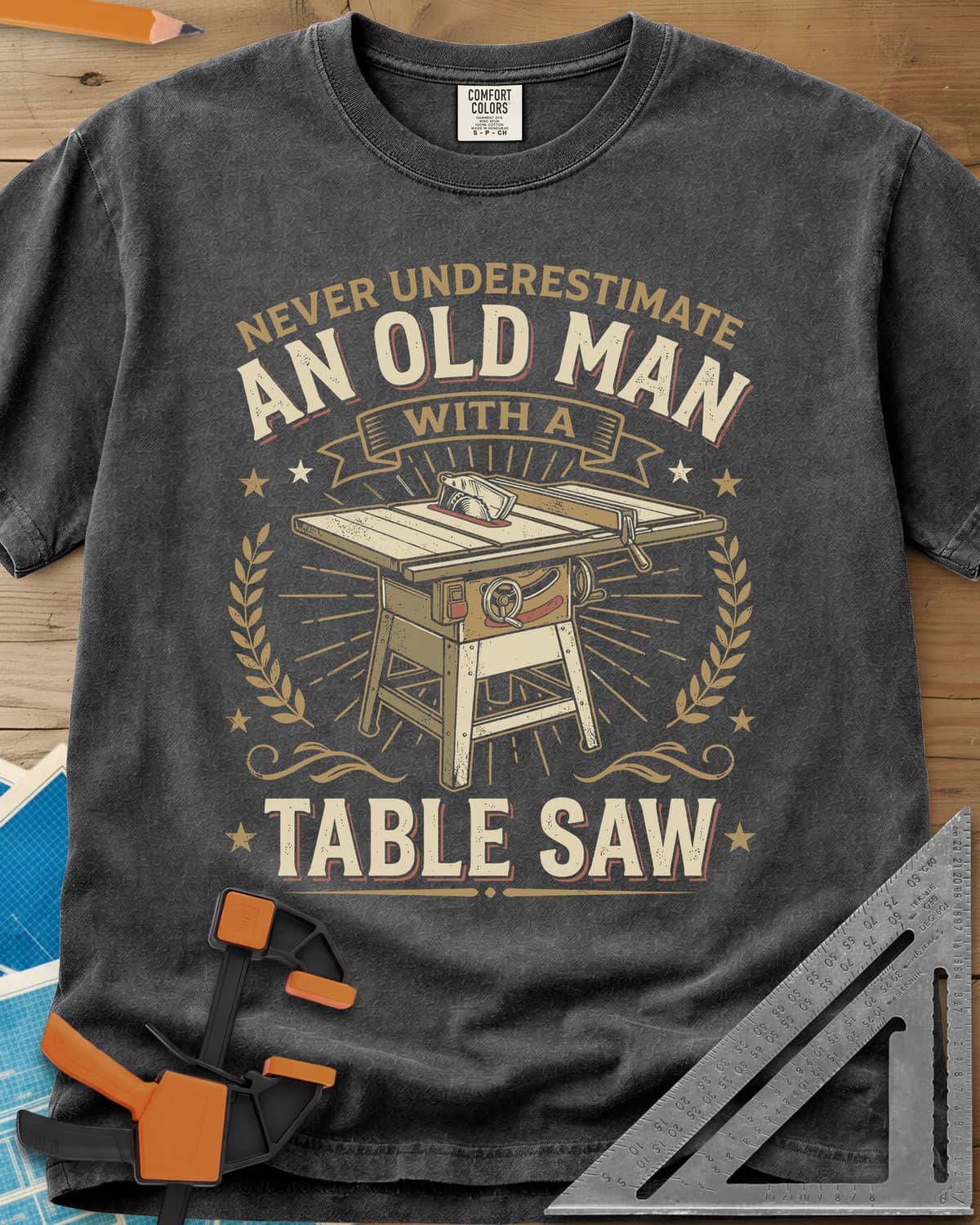 Old Man With A Table Saw heavyweight tee in Pepper, a cabinet table saw in a laurel and star badge with a banner