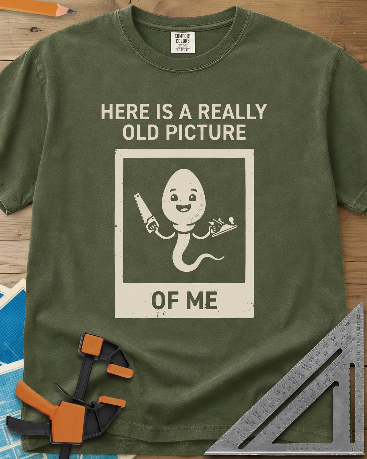 Old Picture heavyweight tee in Hemp, a smiling cartoon figure with a long tail holding a saw and a plane