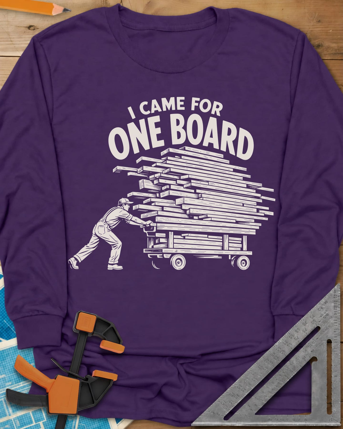 One Board Haul long sleeve shirt in Purple, a man pushing a flatbed cart piled high with lumber