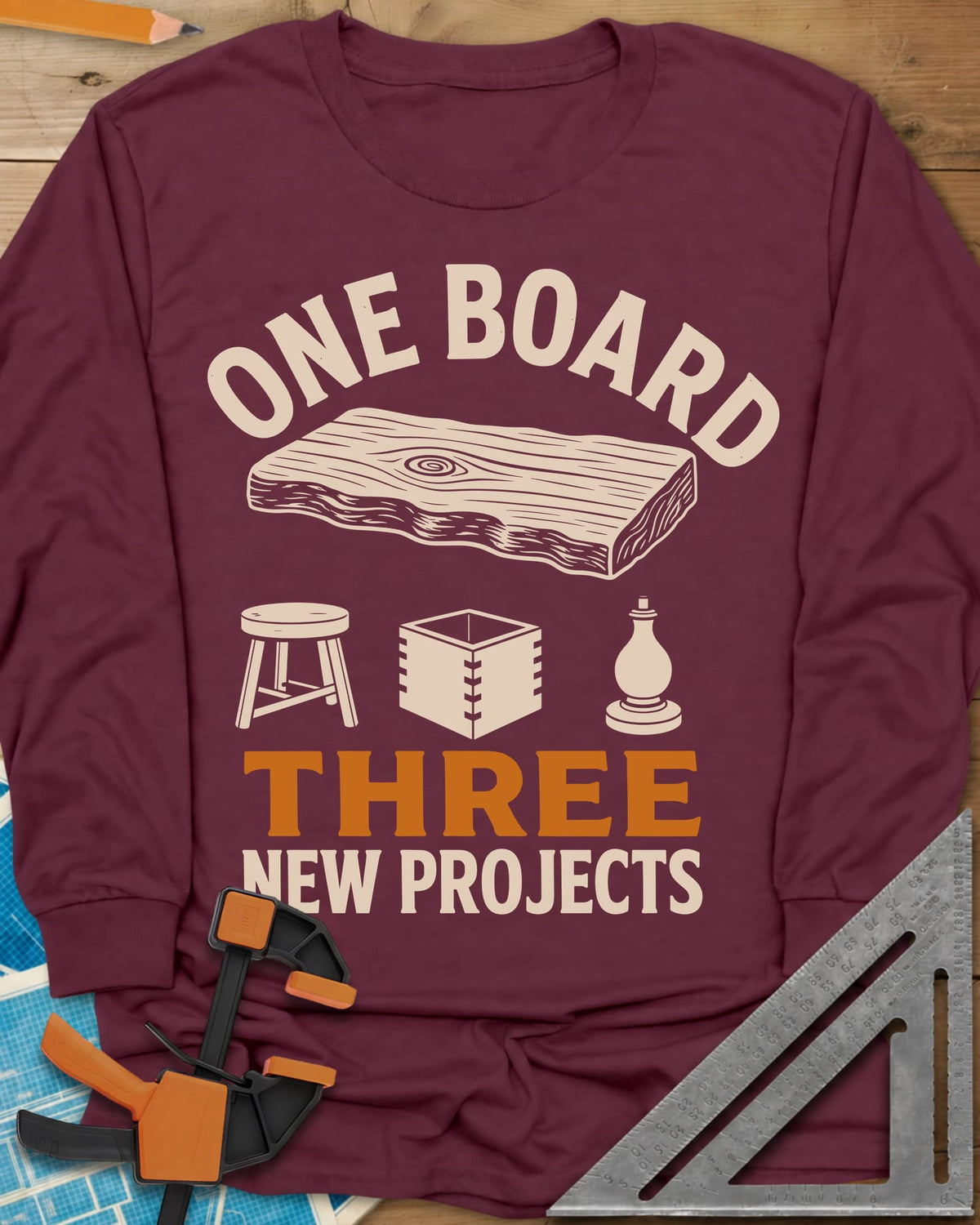 One Board long sleeve shirt in Maroon, a live-edge board over a stool, a box and a turned chess piece