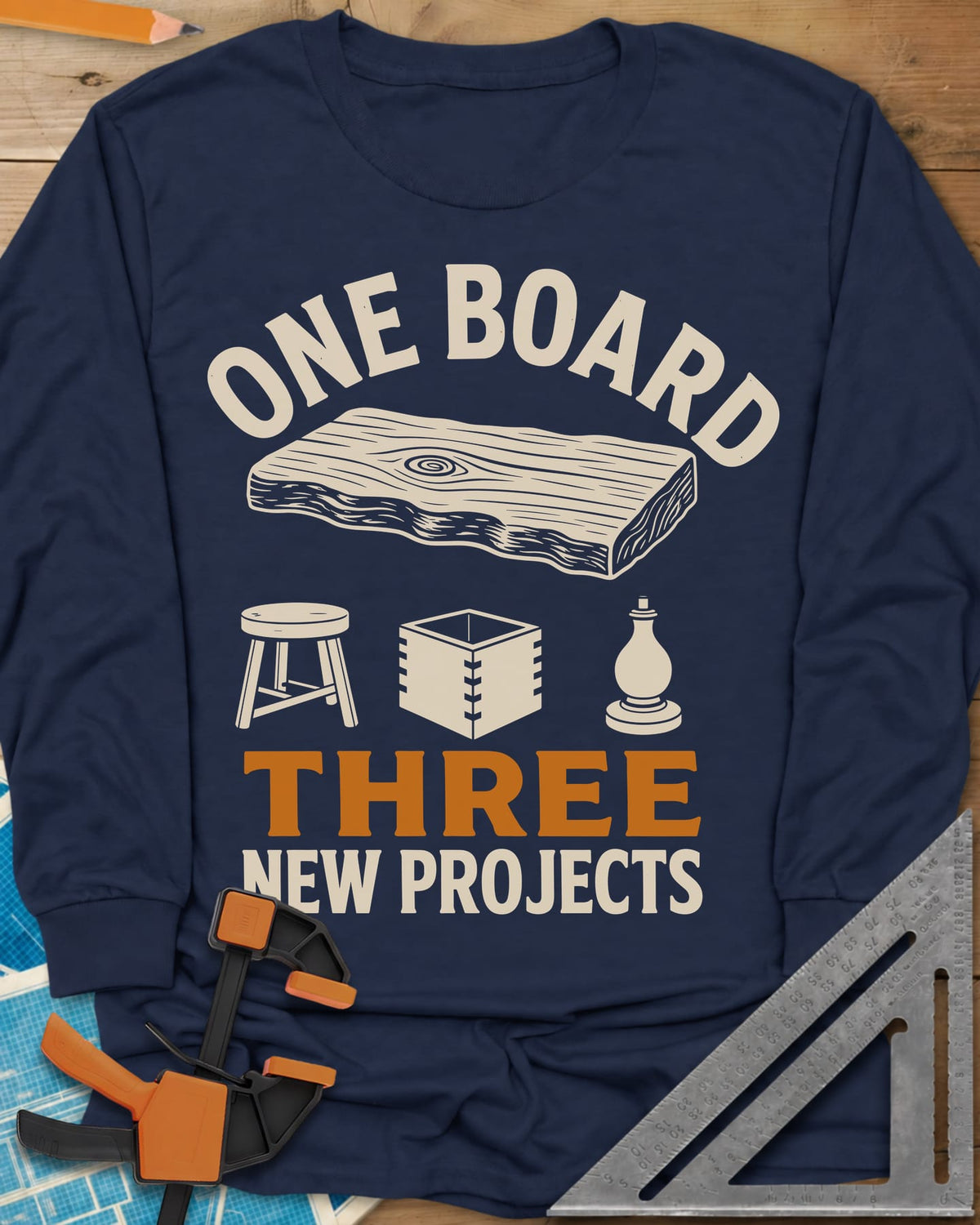 One Board long sleeve shirt in Navy, a live-edge board over a stool, a box and a turned chess piece