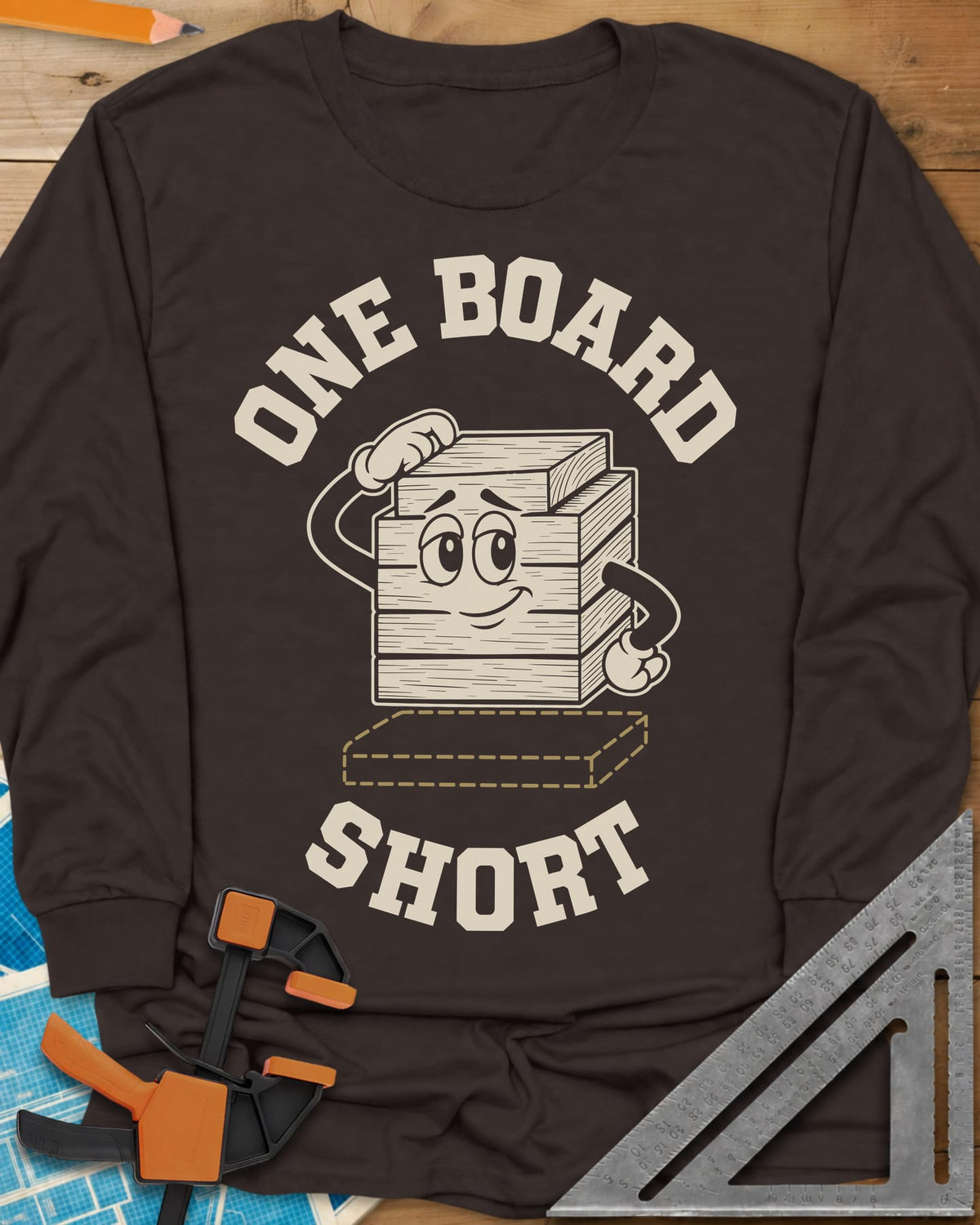 One Board Short long sleeve shirt in Dark Chocolate, a cartoon stack of boards scratching its head over a missing board