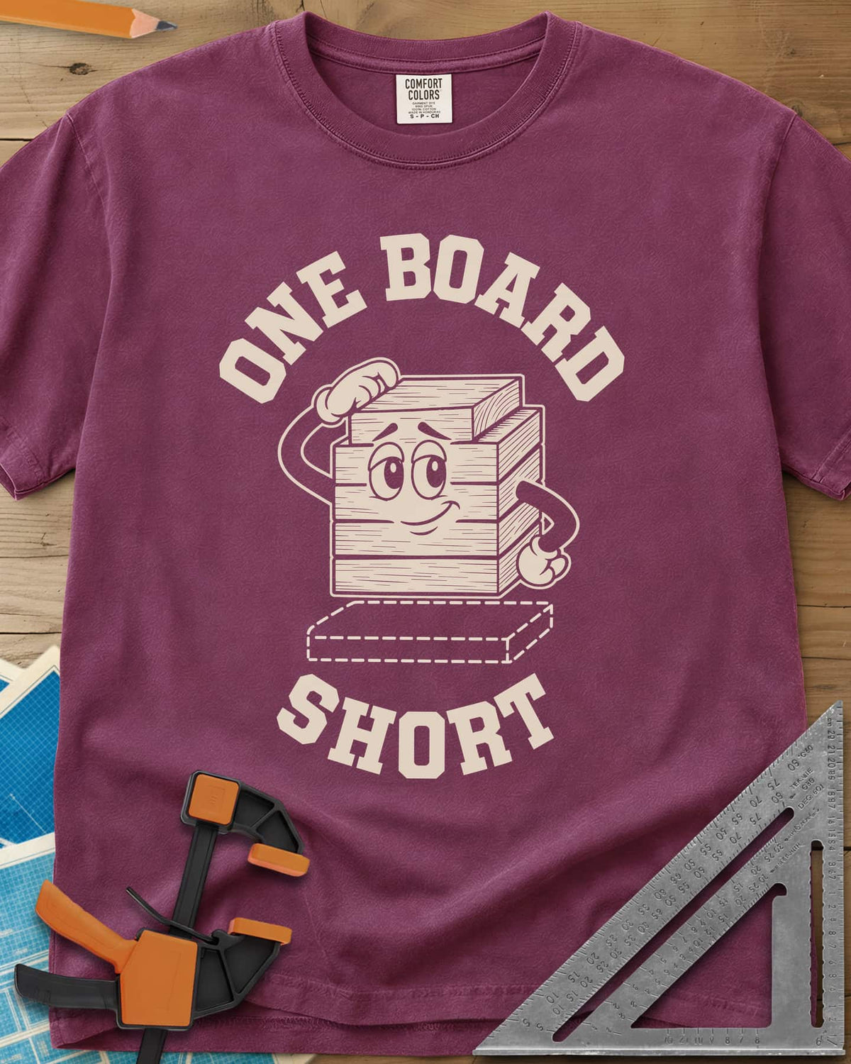 One Board Short heavyweight tee in Berry, a cartoon stack of boards scratching its head over a missing board