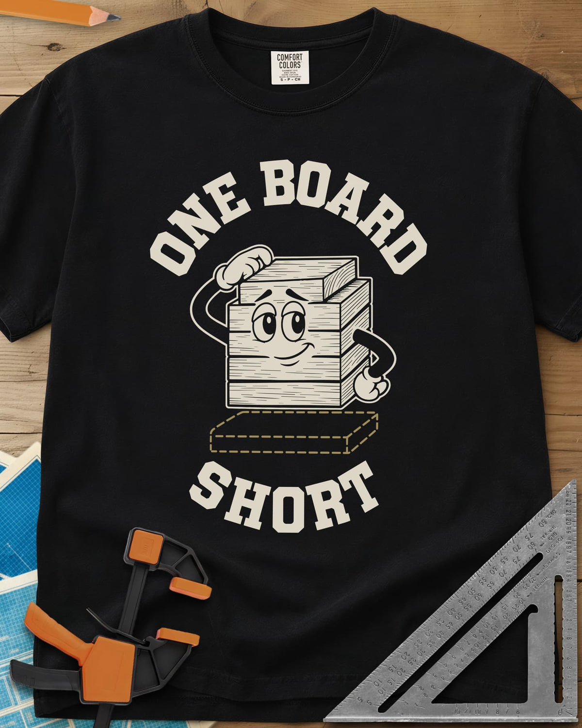 One Board Short heavyweight tee in Black, a cartoon stack of boards scratching its head over a missing board