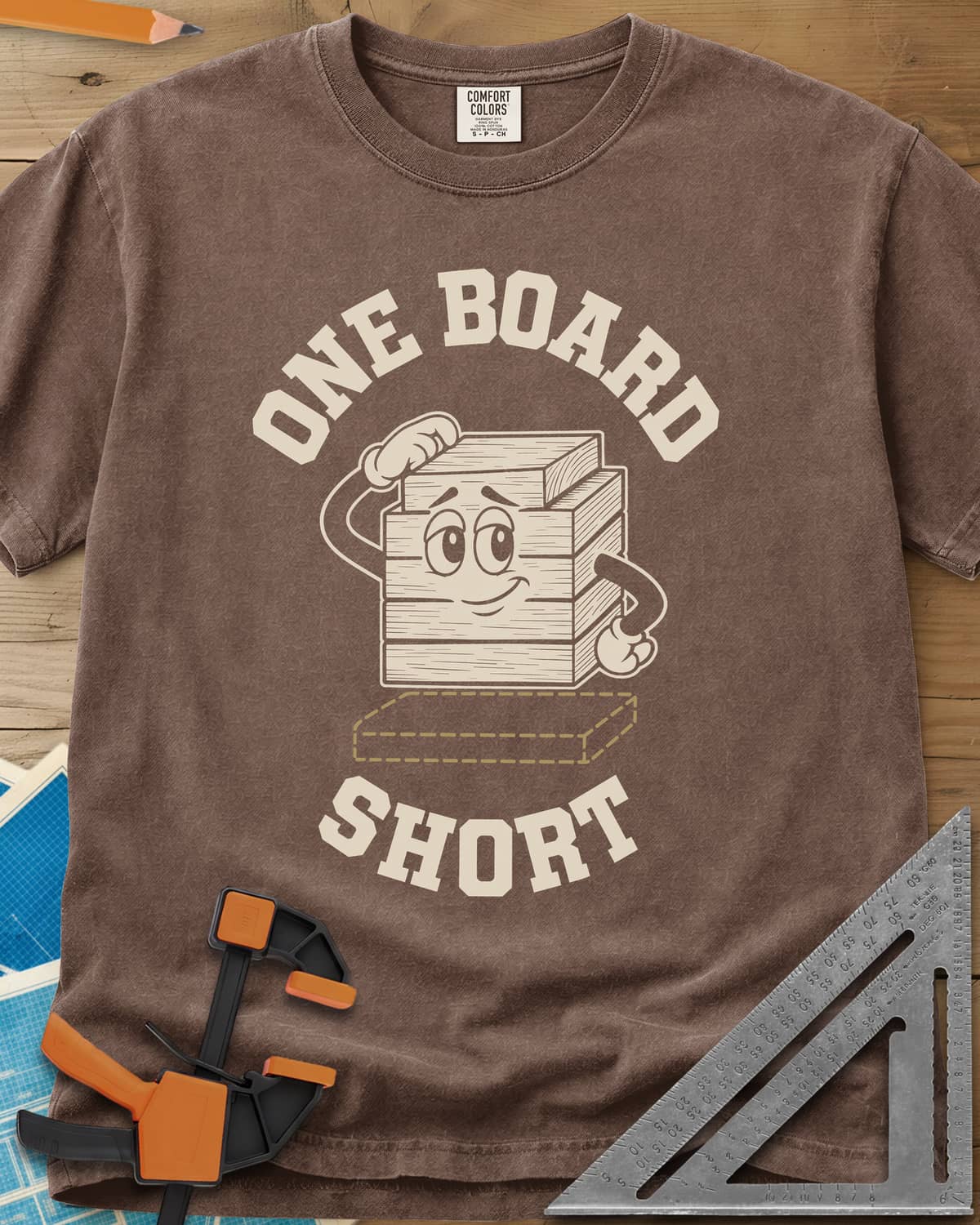 One Board Short heavyweight tee in Espresso, a cartoon stack of boards scratching its head over a missing board