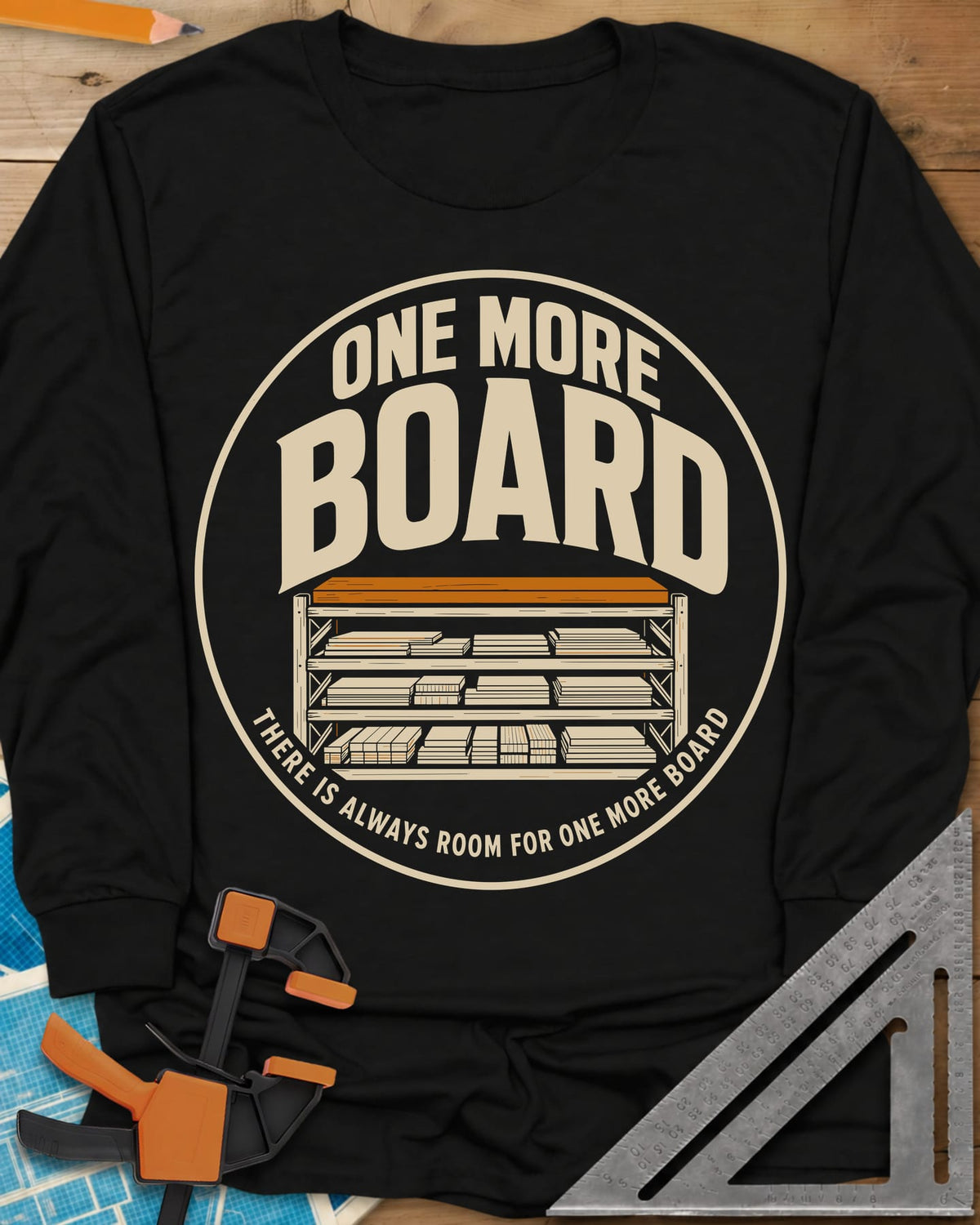 One More Board long sleeve shirt in Black, a round badge with a rack of stacked lumber