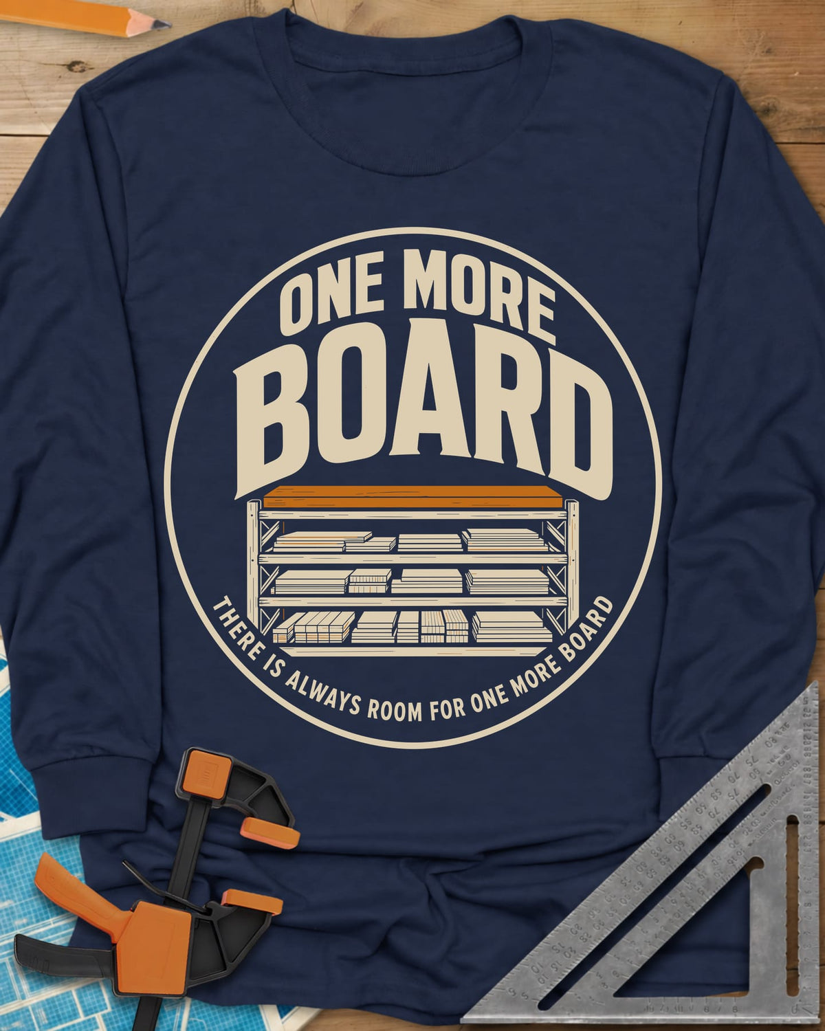 One More Board long sleeve shirt in Navy, a round badge with a rack of stacked lumber