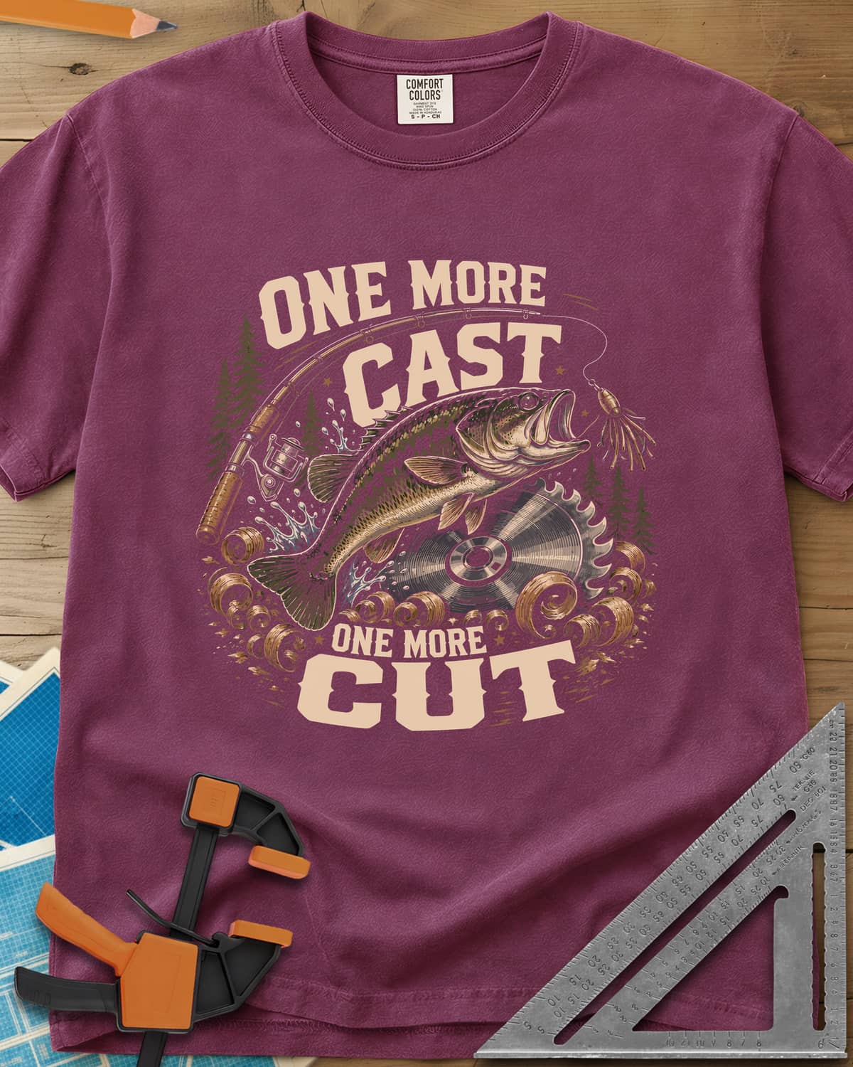One More Cast One More Cut heavyweight tee in Berry, a leaping bass, saw blade, fishing rod and wood curls