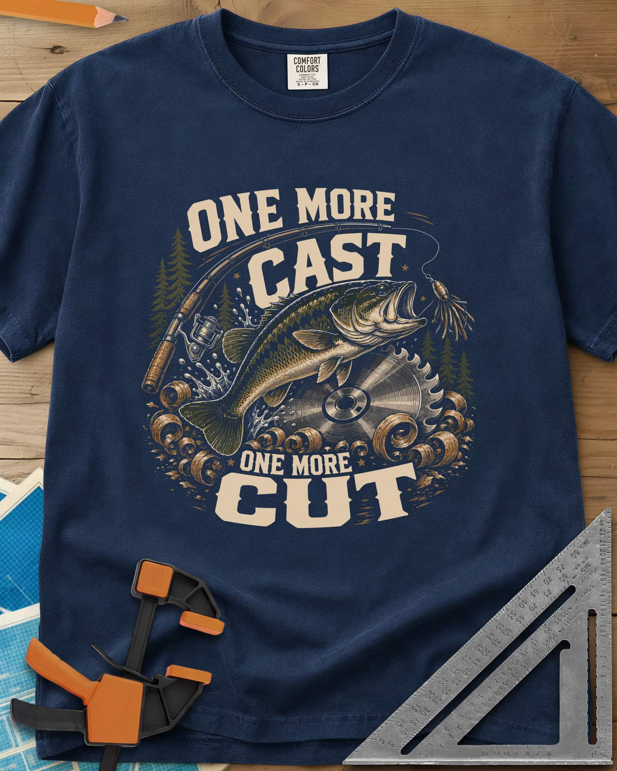 One More Cast One More Cut heavyweight tee in Navy, a leaping bass, saw blade, fishing rod and wood curls
