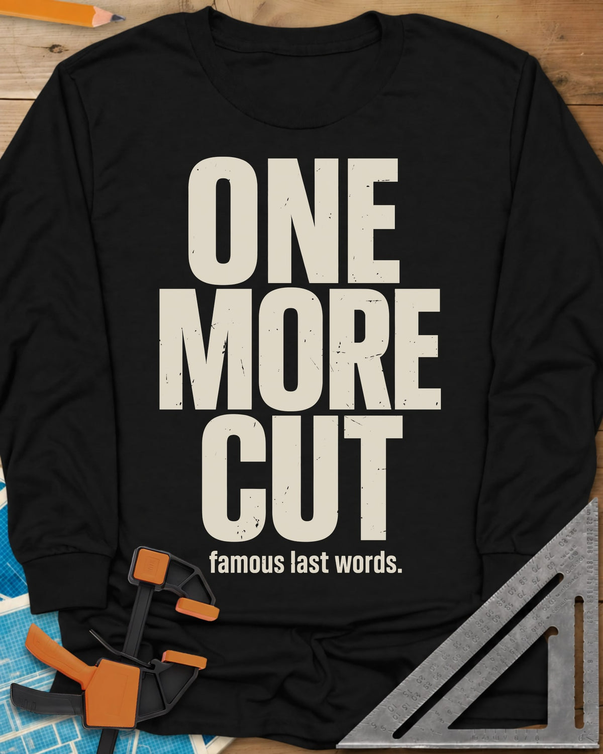 One More Cut long sleeve shirt in Black, tall stacked distressed block letters