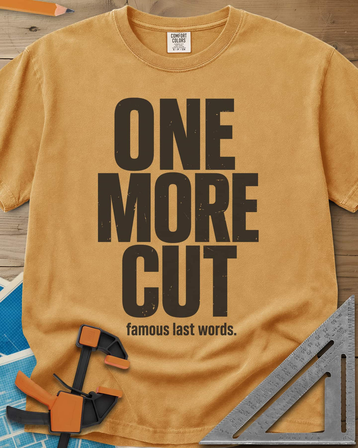 One More Cut heavyweight tee in Mustard, tall stacked distressed block letters