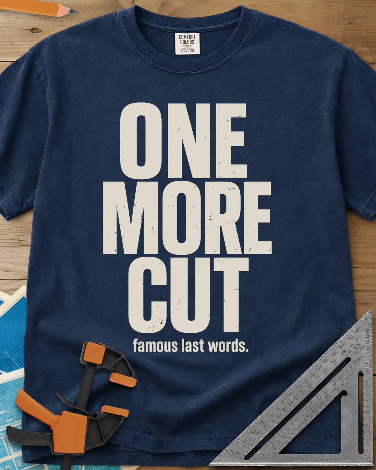 One More Cut heavyweight tee in Navy, tall stacked distressed block letters