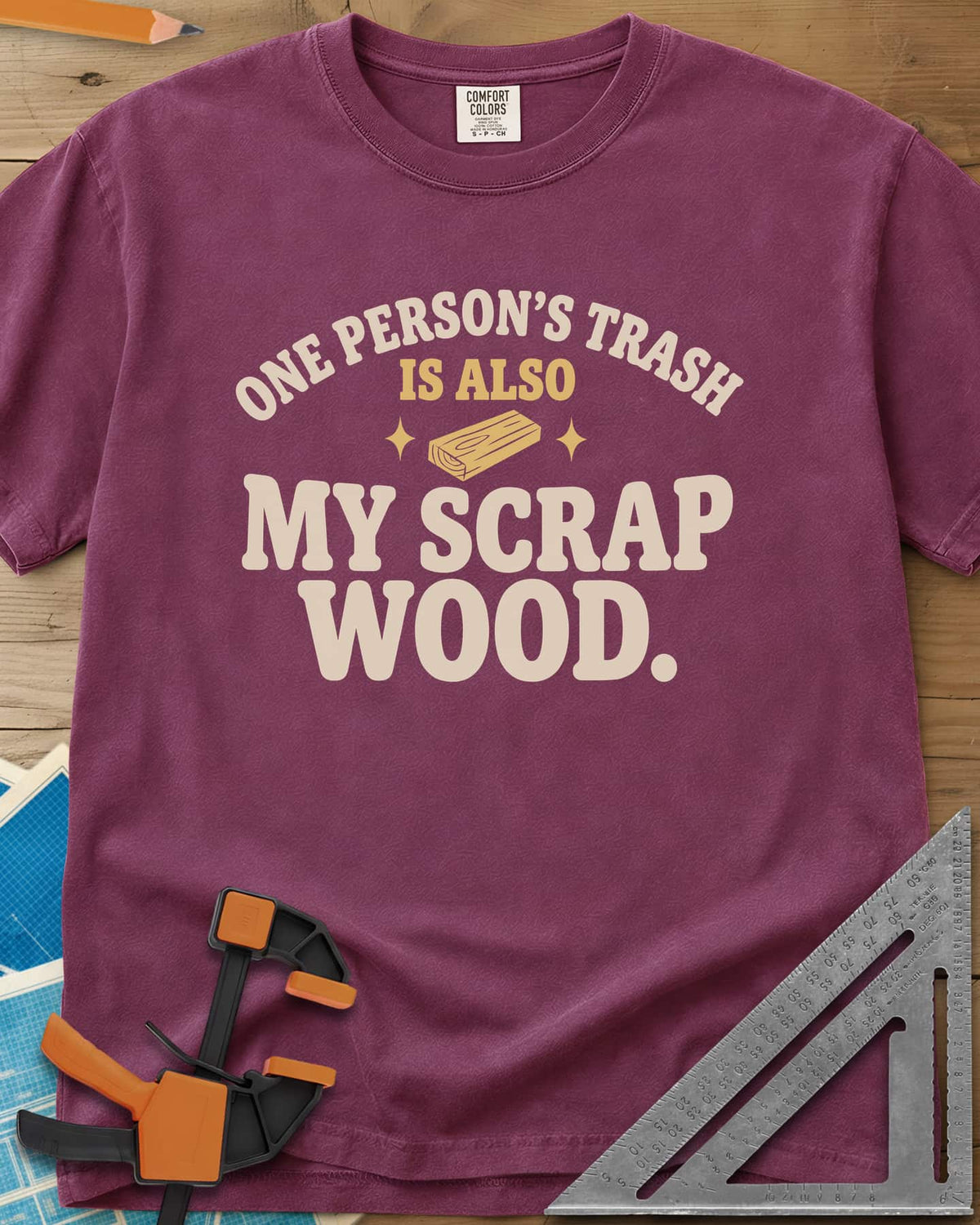 One Person's Trash heavyweight tee in Berry, a small wood block between two sparkles under arched text