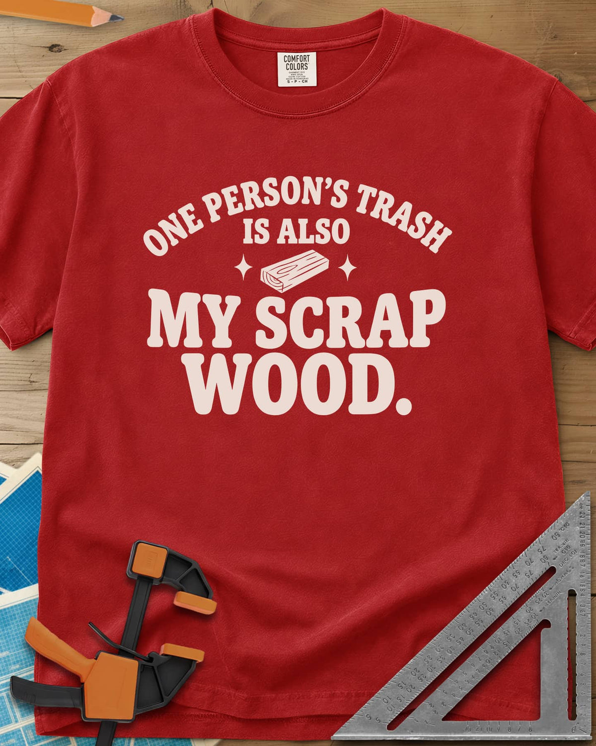 One Person's Trash heavyweight tee in Red, a small wood block between two sparkles under arched text