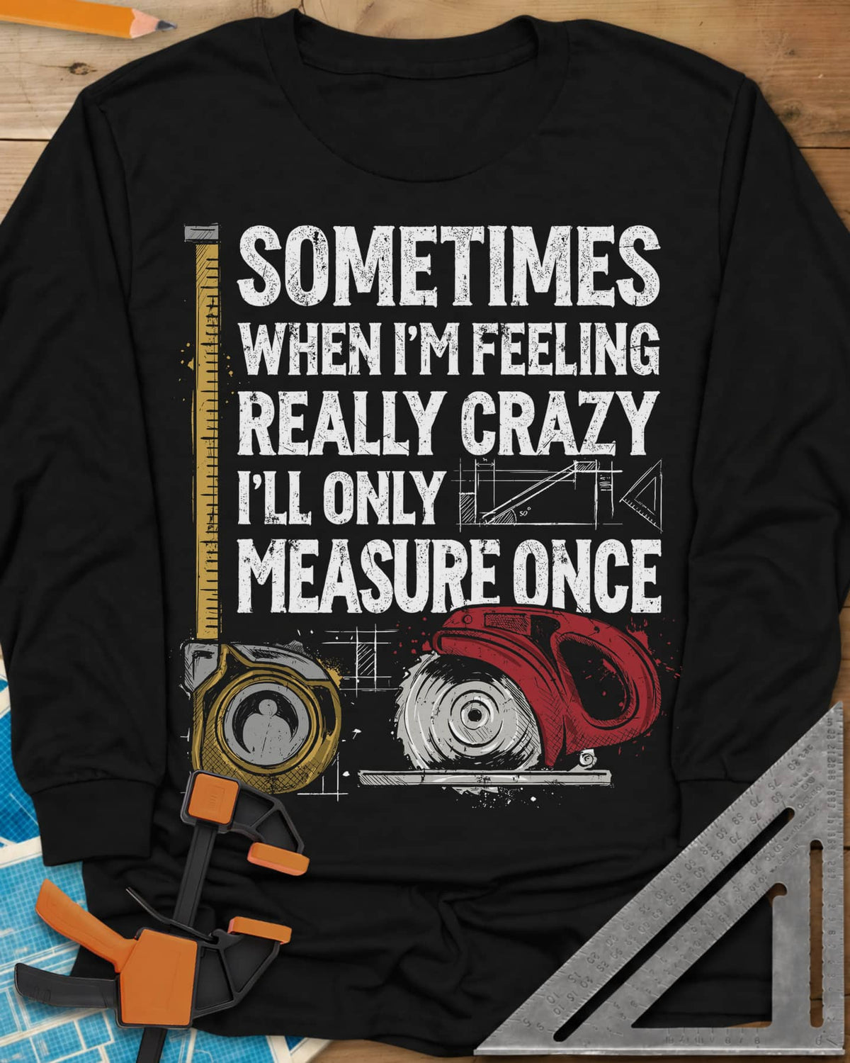 Only Measure Once long sleeve shirt in Black, block letters with a yellow tape measure and a red circular saw