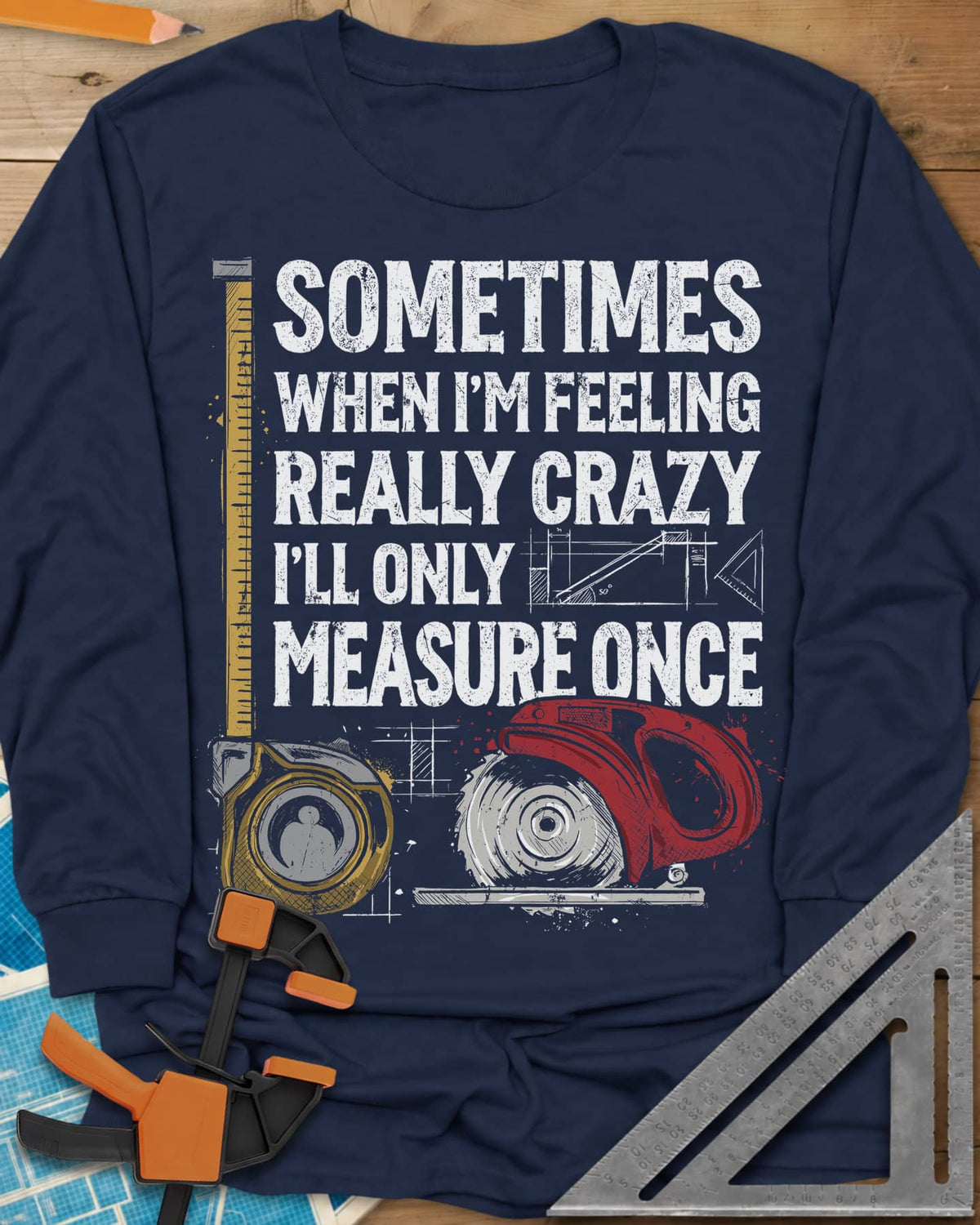 Only Measure Once long sleeve shirt in Navy, block letters with a yellow tape measure and a red circular saw