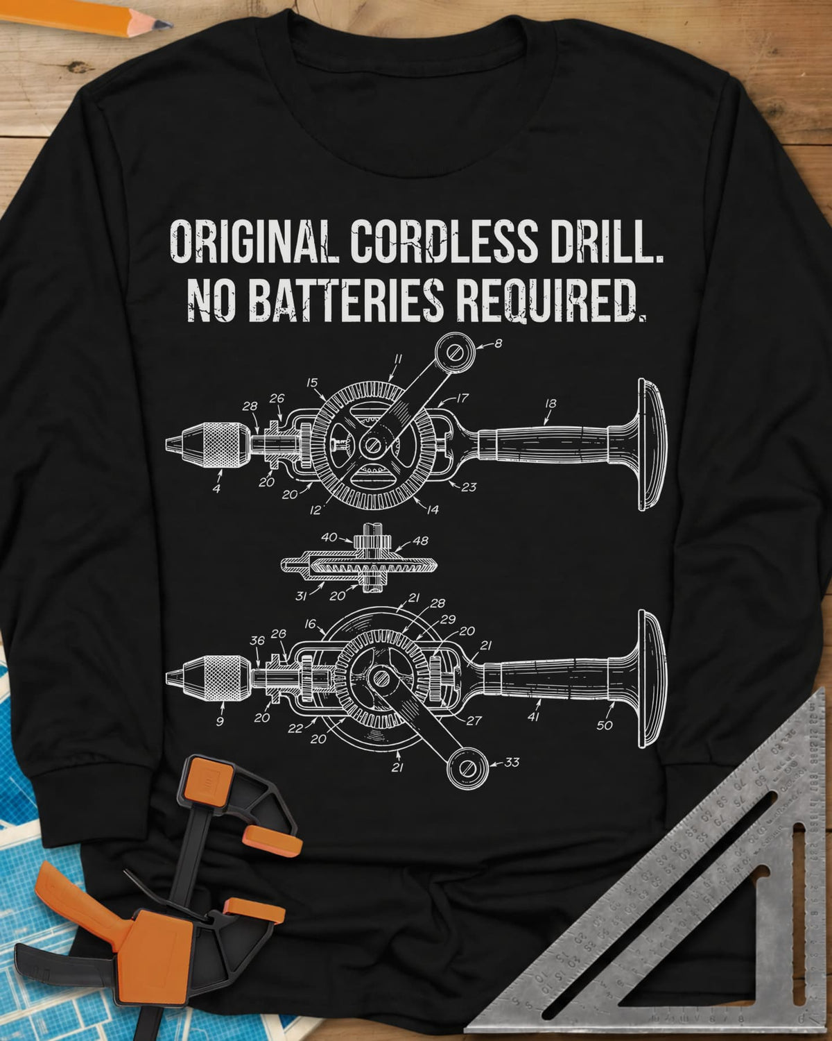 Original Cordless Drill long sleeve shirt in Black, patent-style drawings of a hand-crank drill with numbered parts