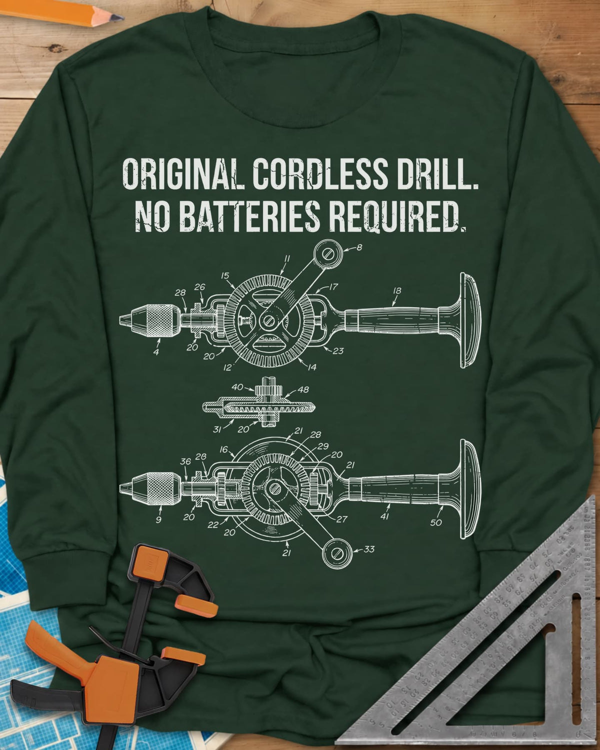 Original Cordless Drill long sleeve shirt in Forest Green, patent-style drawings of a hand-crank drill with numbered parts