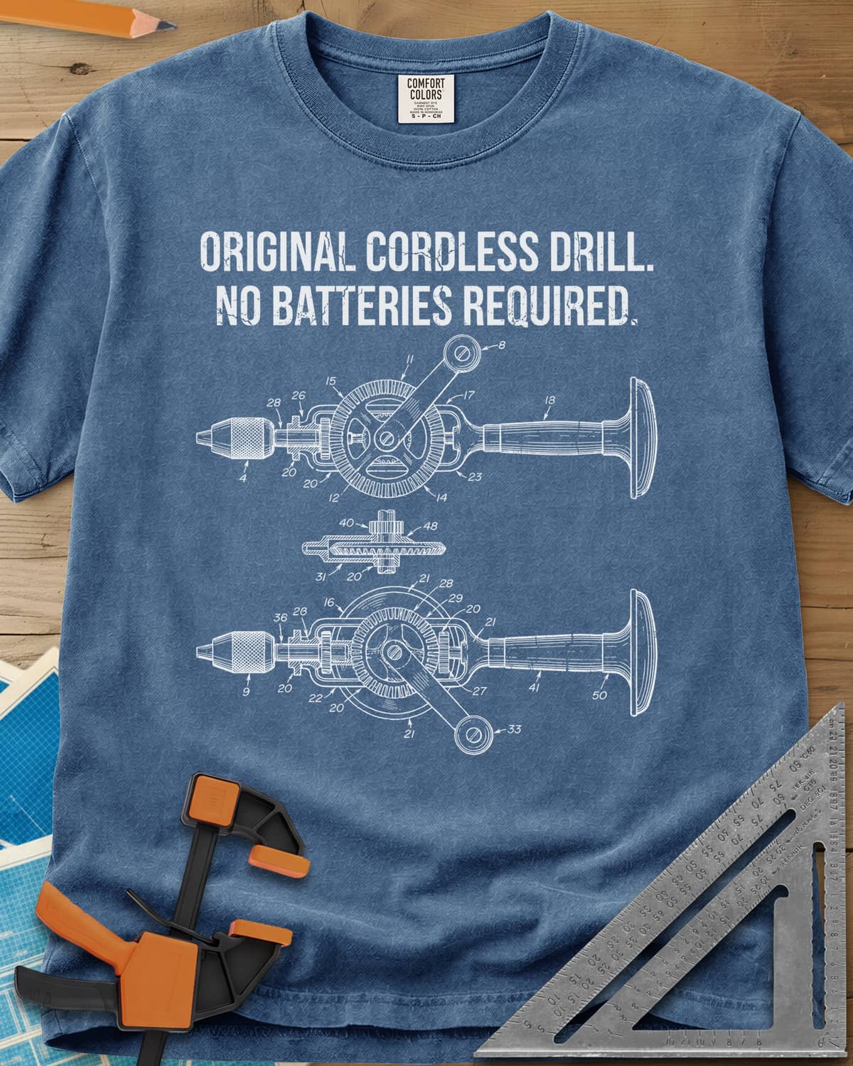 Original Cordless Drill heavyweight tee in Blue Jean, patent-style drawings of a hand-crank drill with numbered parts
