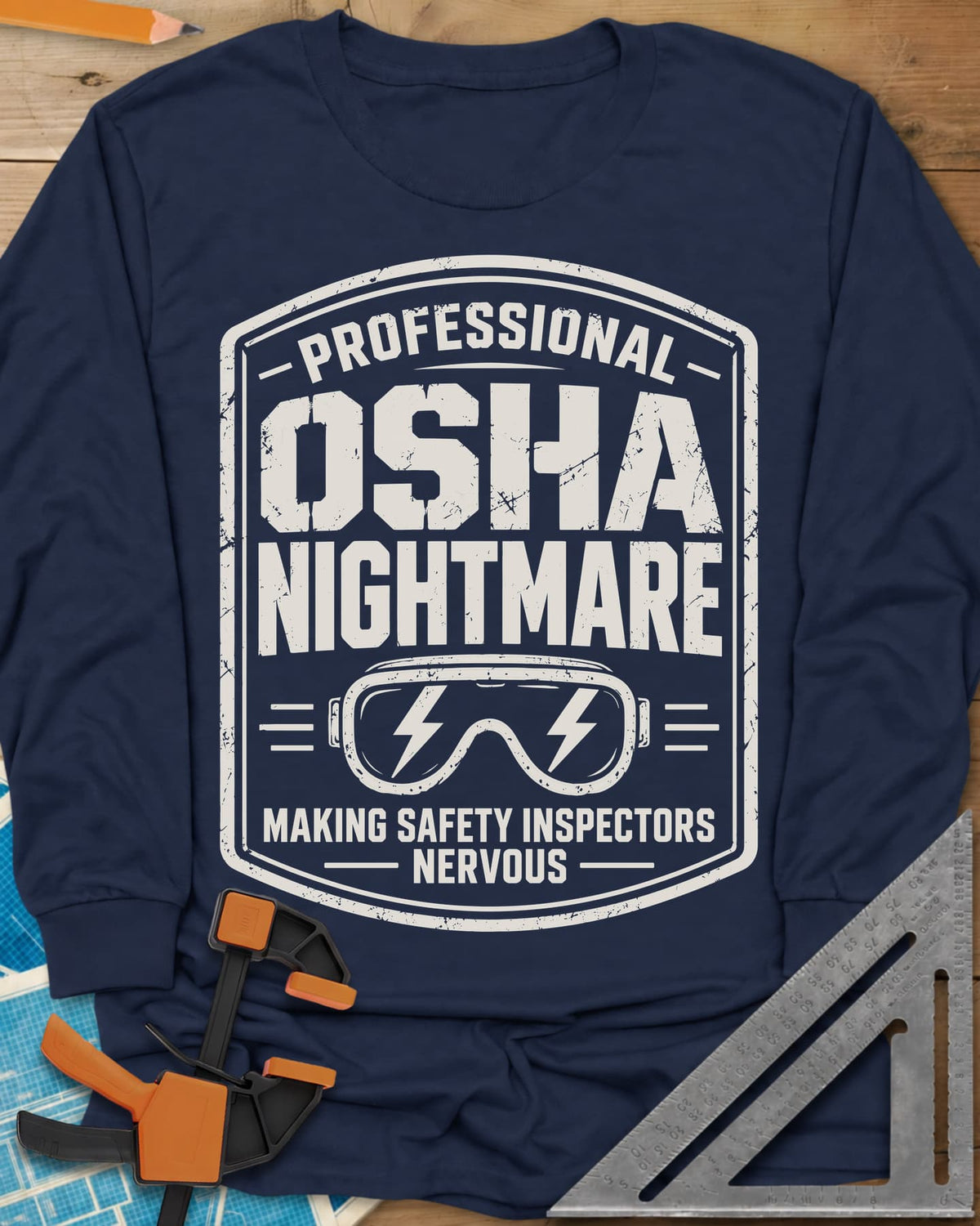 OSHA Nightmare long sleeve shirt in Navy, a rugged badge with safety goggles and lightning bolts