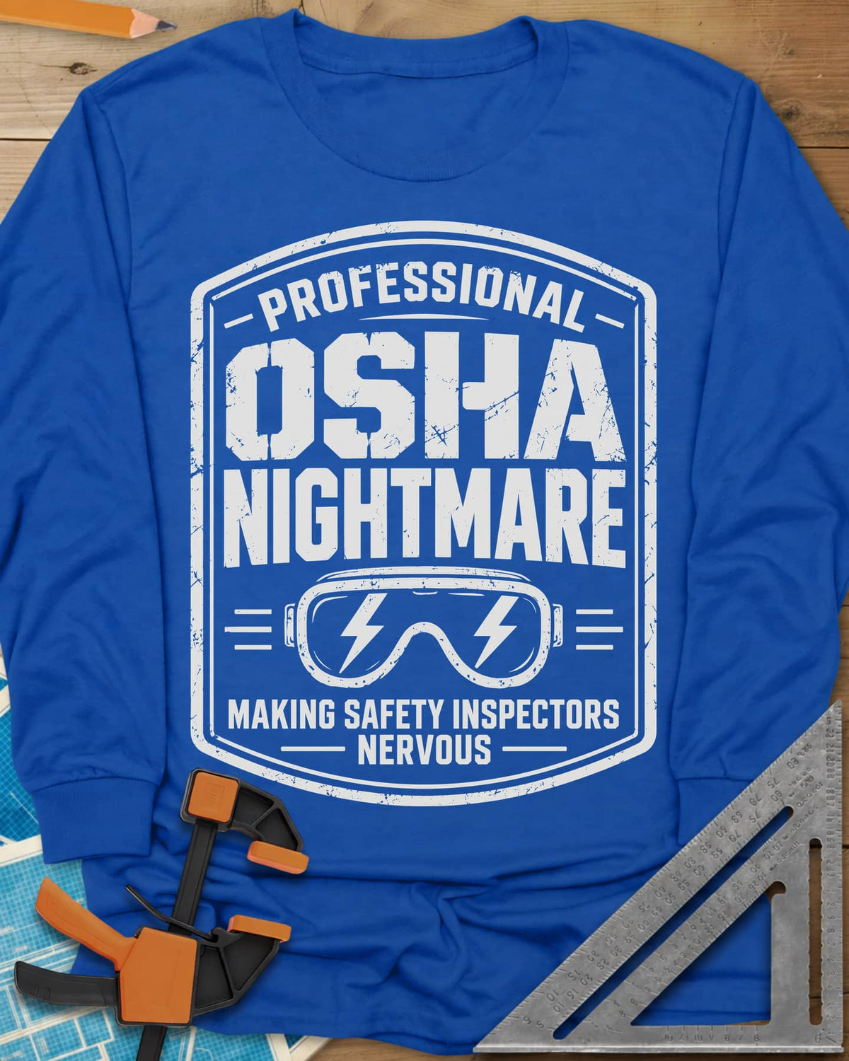 OSHA Nightmare long sleeve shirt in Royal, a rugged badge with safety goggles and lightning bolts
