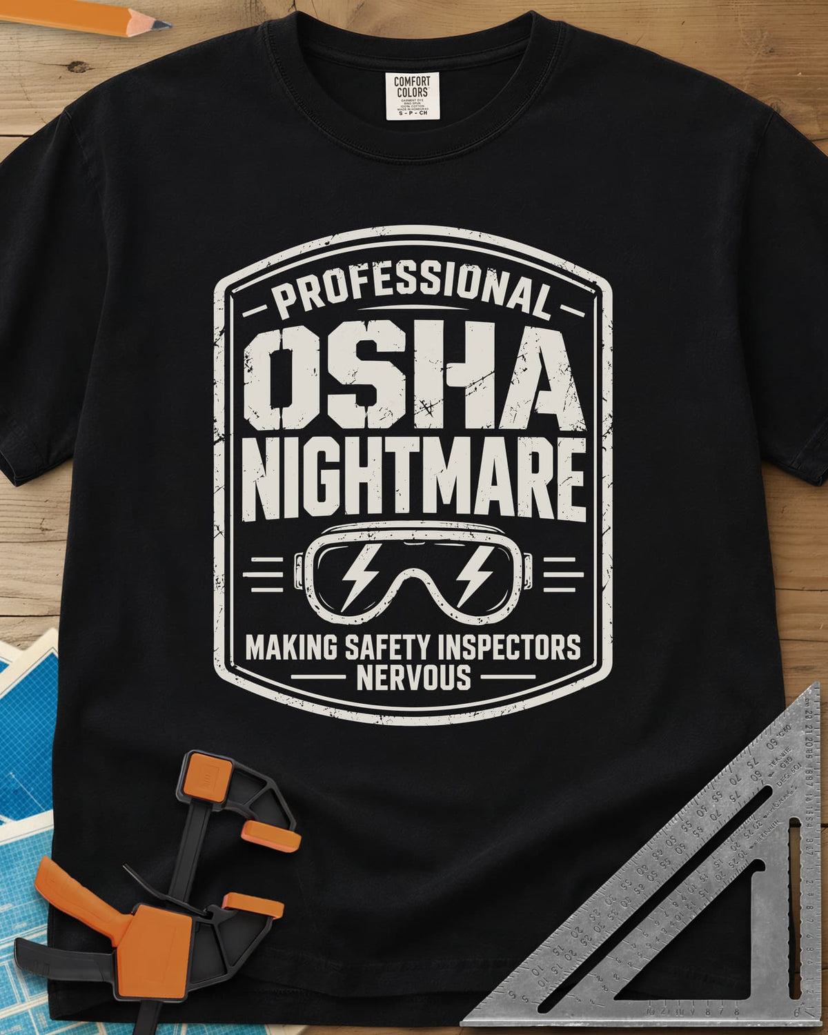 OSHA Nightmare heavyweight tee in Black, a rugged badge with safety goggles and lightning bolts