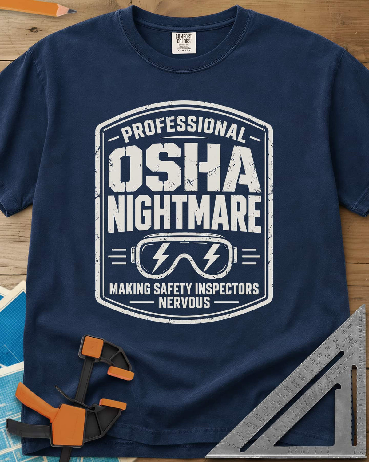 OSHA Nightmare heavyweight tee in Navy, a rugged badge with safety goggles and lightning bolts