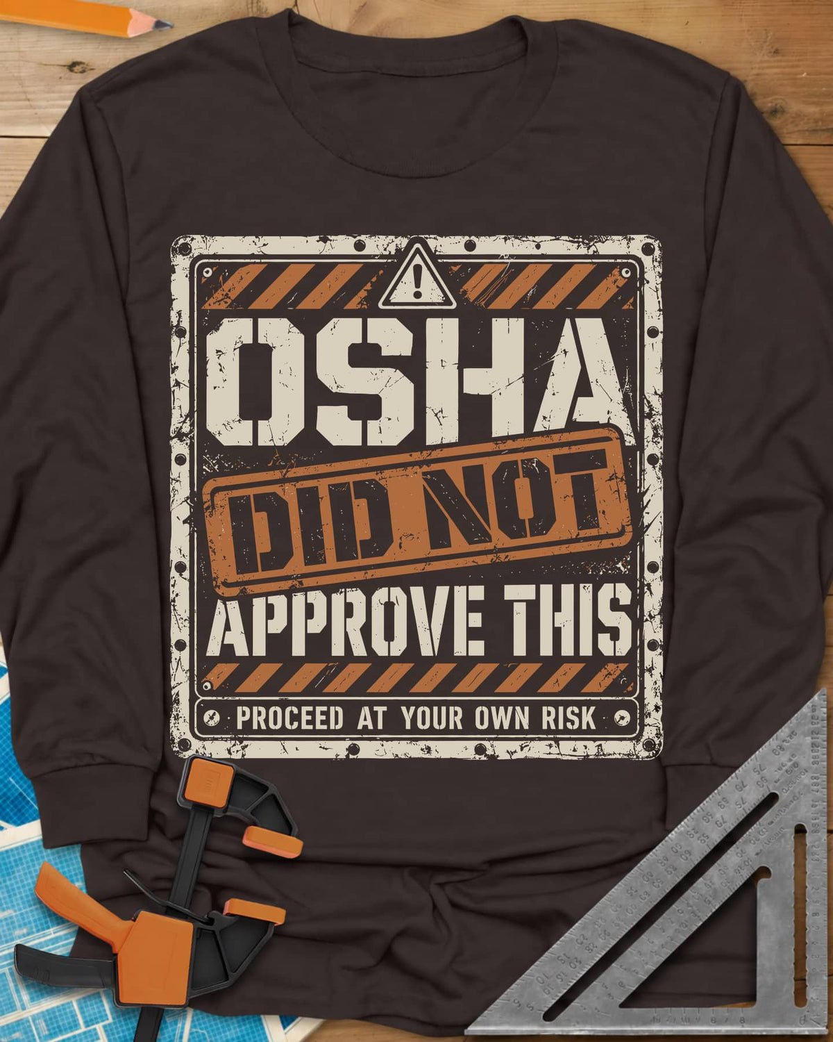 OSHA Not Approved long sleeve shirt in Dark Chocolate, a worn warning sign with hazard stripes and a DID NOT stamp