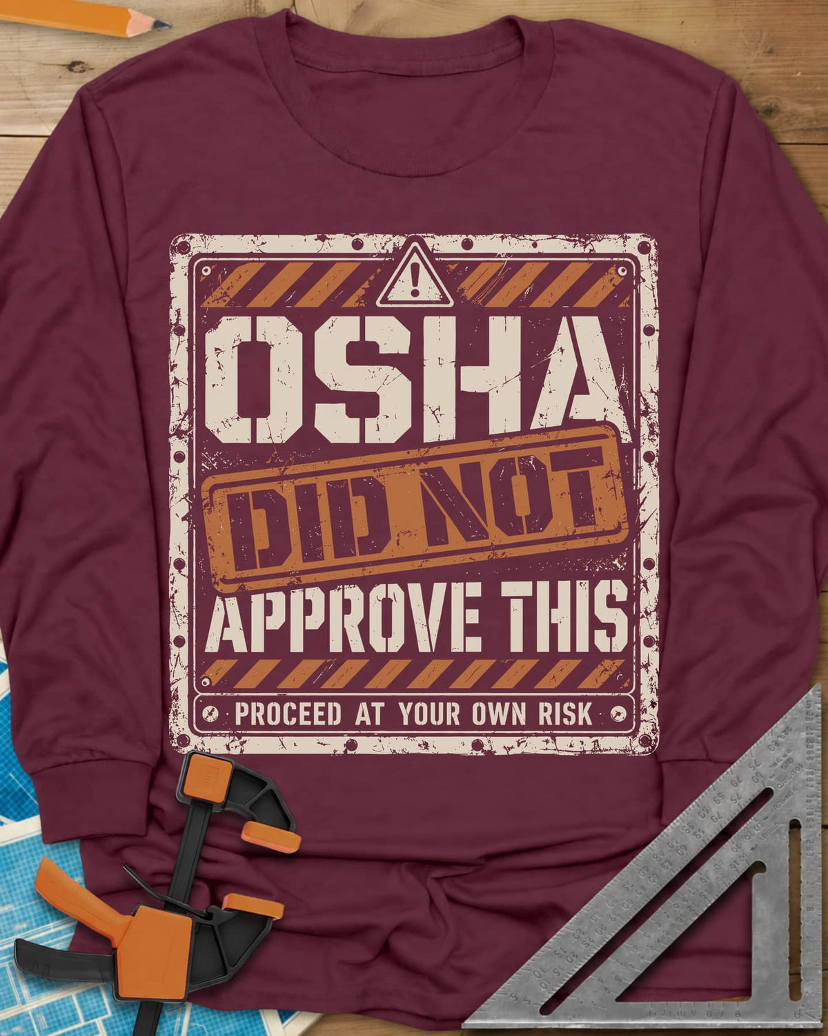 OSHA Not Approved long sleeve shirt in Maroon, a worn warning sign with hazard stripes and a DID NOT stamp