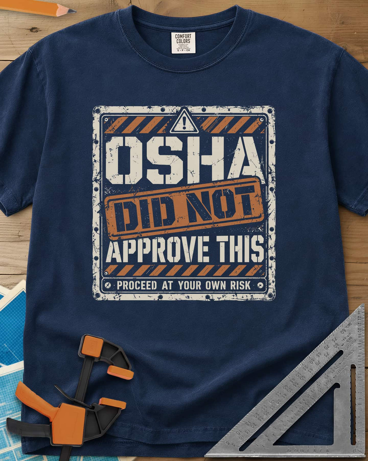 OSHA Not Approved heavyweight tee in Navy, a worn warning sign with hazard stripes and a DID NOT stamp