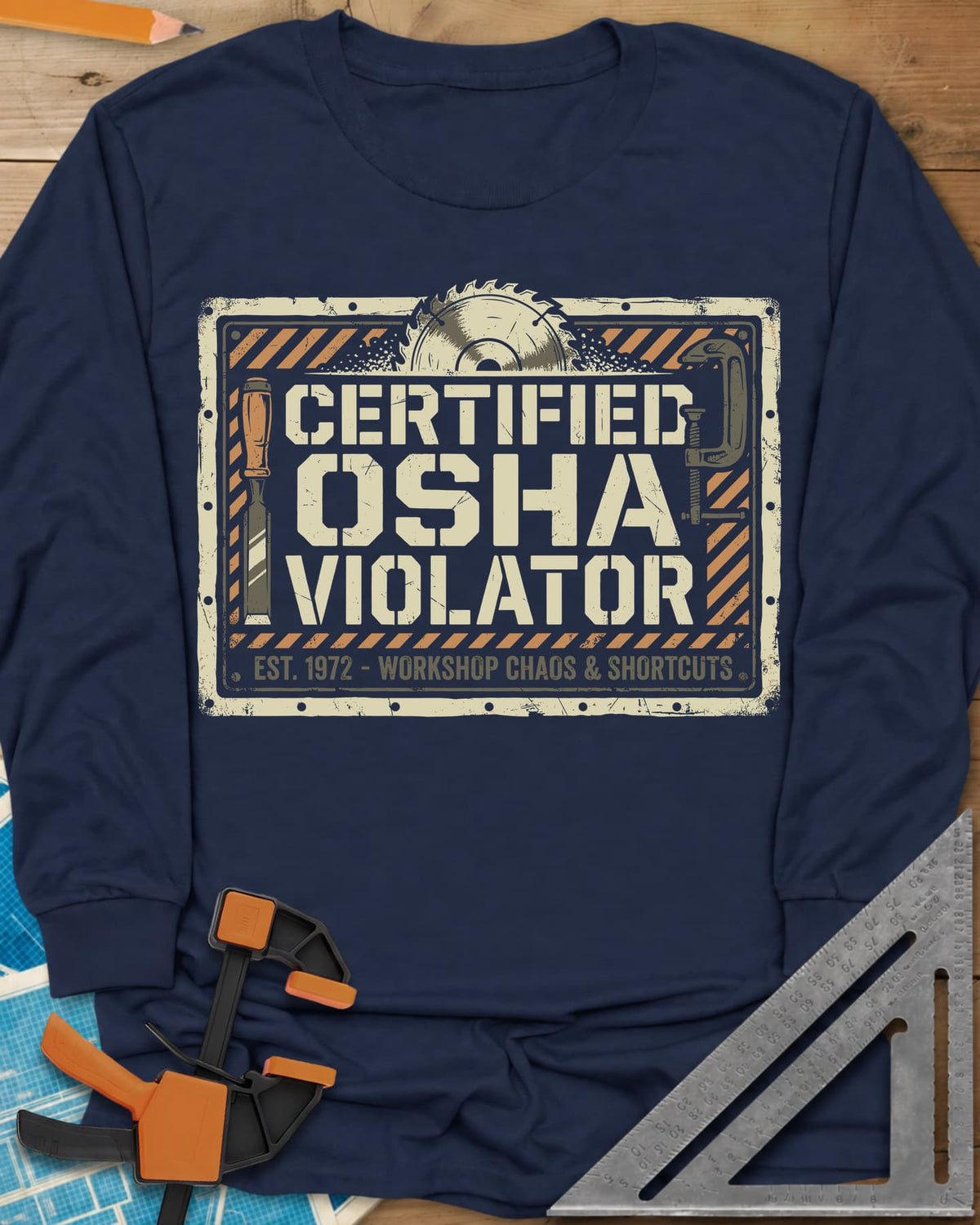 Osha Violator long sleeve shirt in Navy, a hazard-striped warning sign with a saw blade, chisel and clamp
