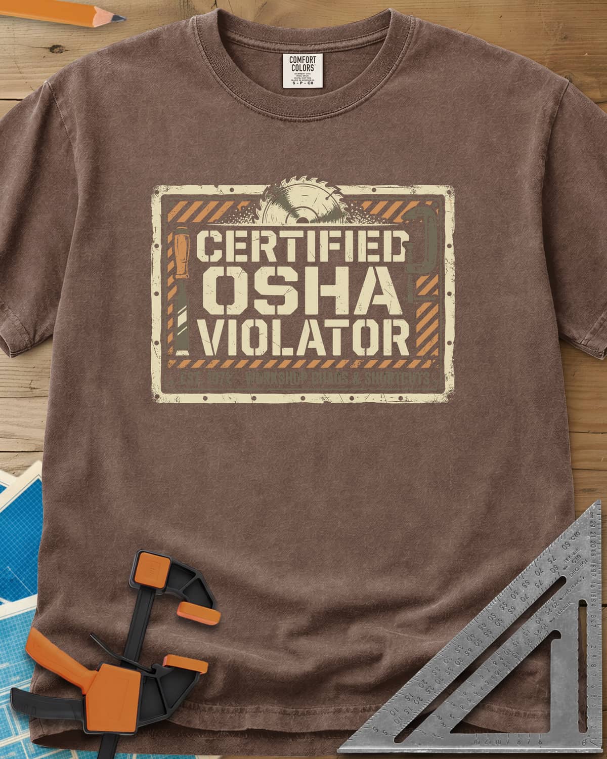 Osha Violator heavyweight tee in Espresso, a hazard-striped warning sign with a saw blade, chisel and clamp