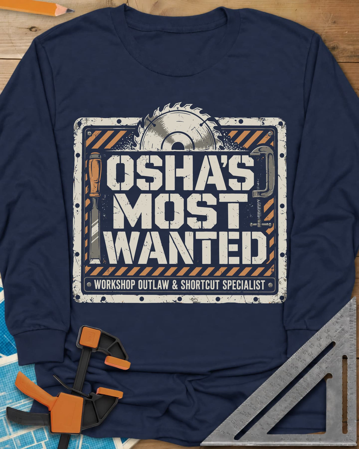 OSHA'S Most Wanted long sleeve shirt in Navy, a saw blade, chisel and C-clamp around a hazard-striped plate